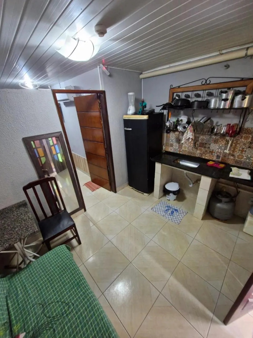 Kitchen or kitchenette in Kitnets com AR Condicionado na Praia