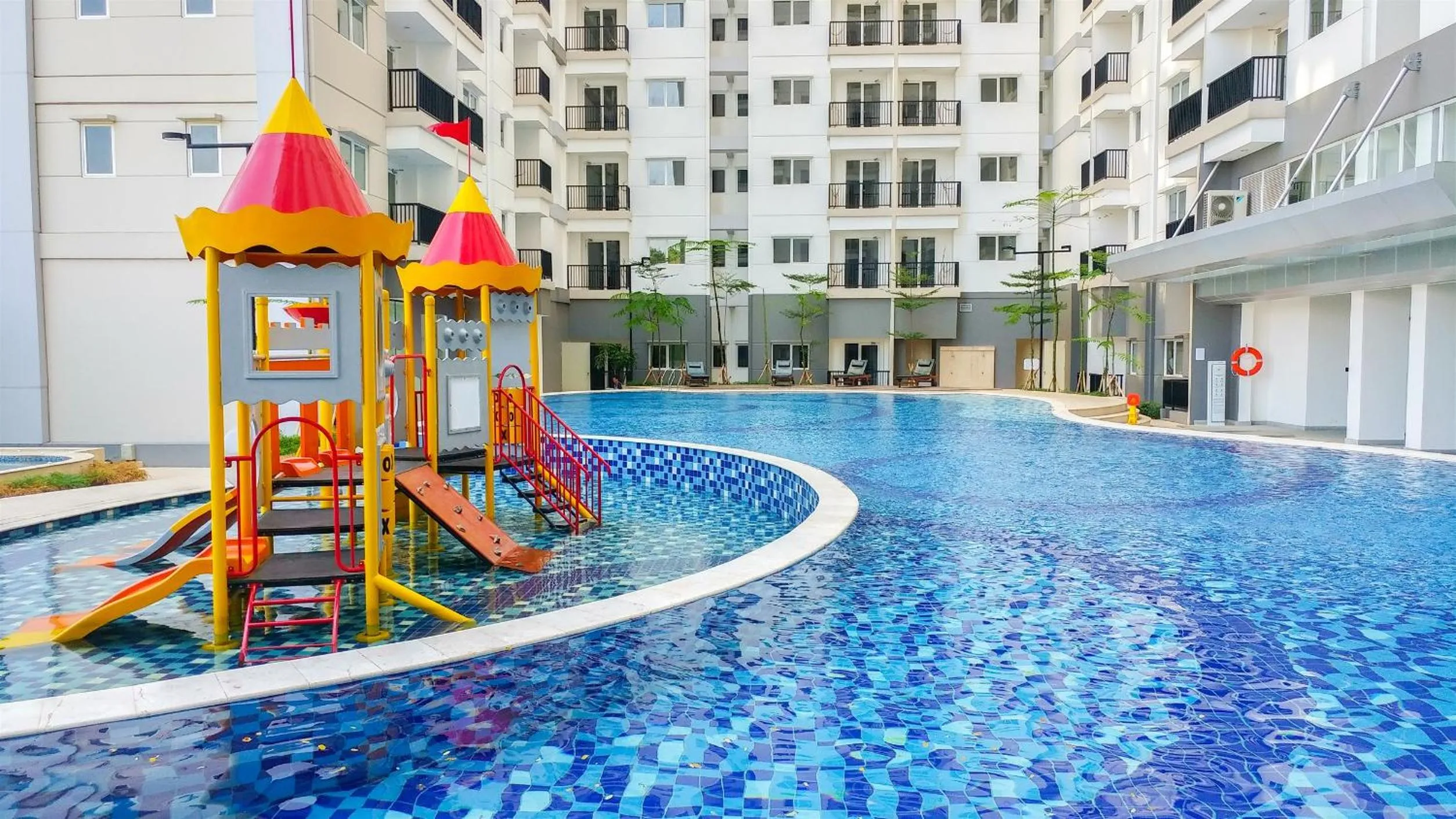 Swimming pool in Fabulous 2BR Signature Park Grande Apartment By Travelio