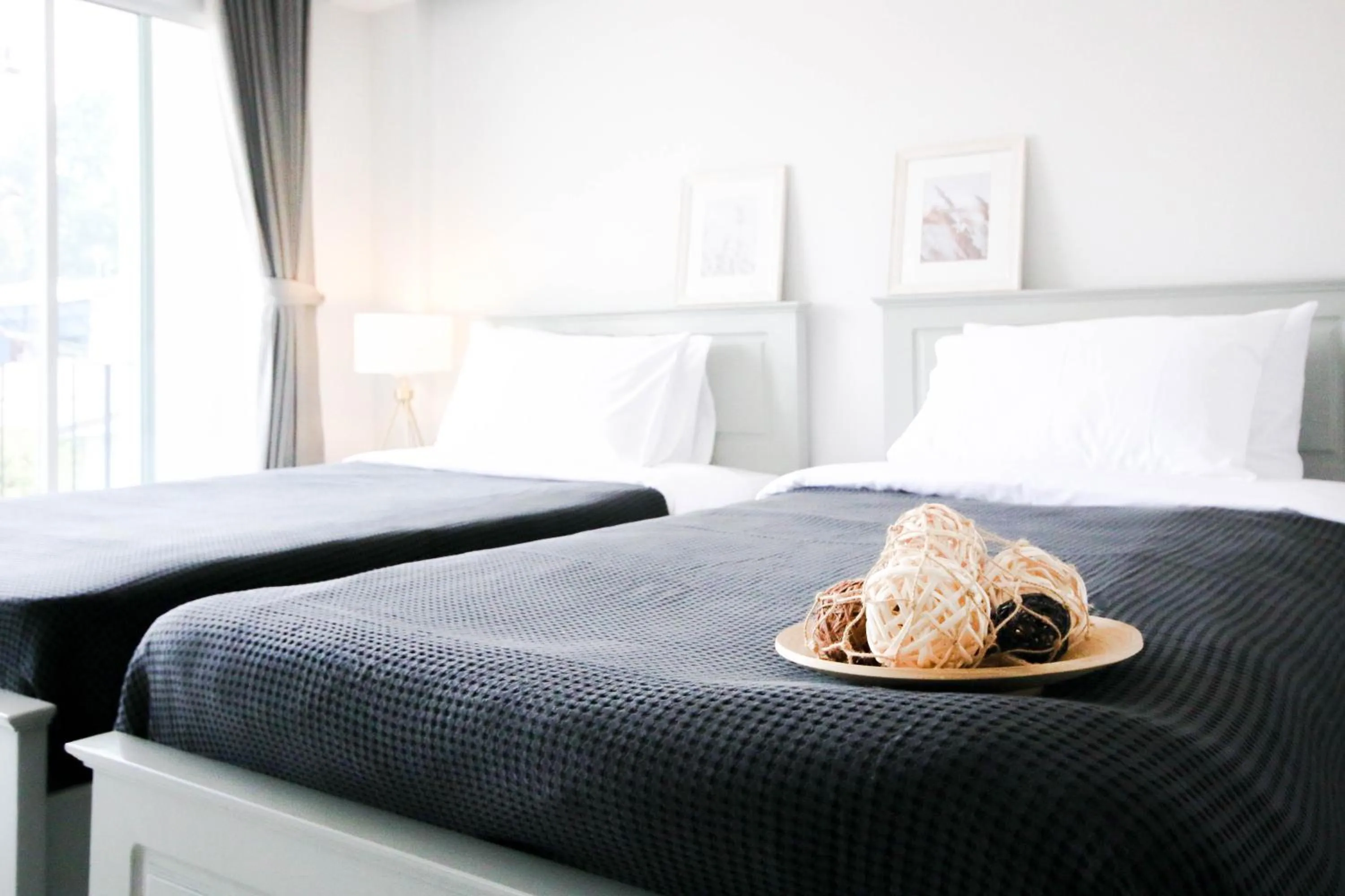 Bed in Tonkla Boutique Hotel