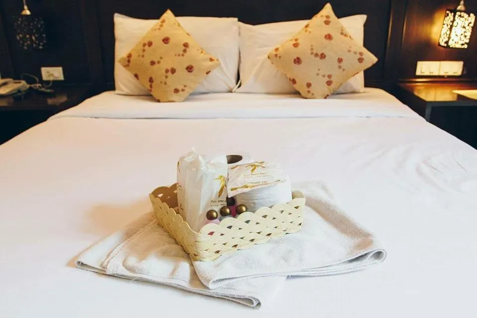 Bed in Palm Sweet Resort