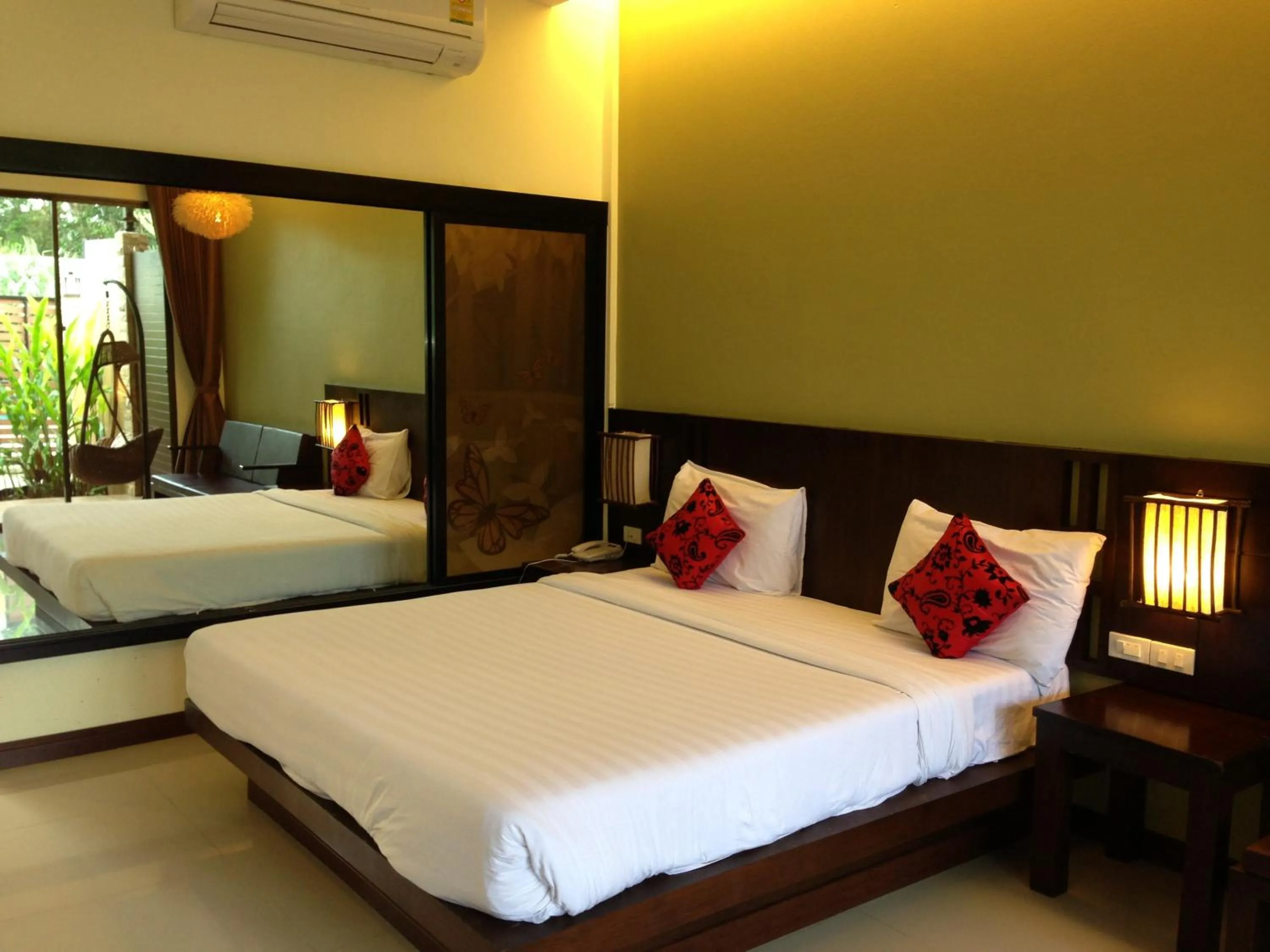 Bed in Palm Sweet Resort