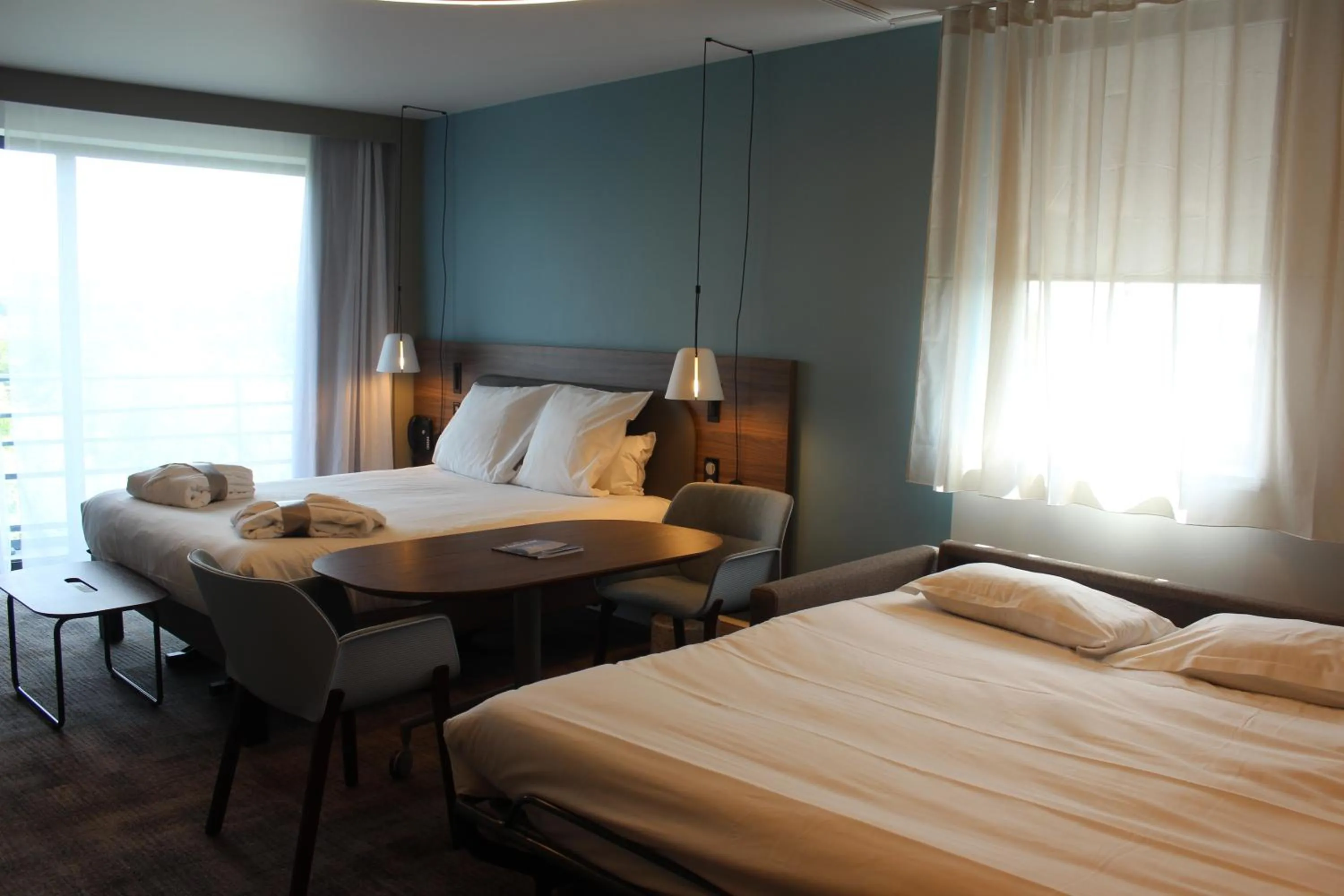 Bed in Novotel Suites Rouen Normandie