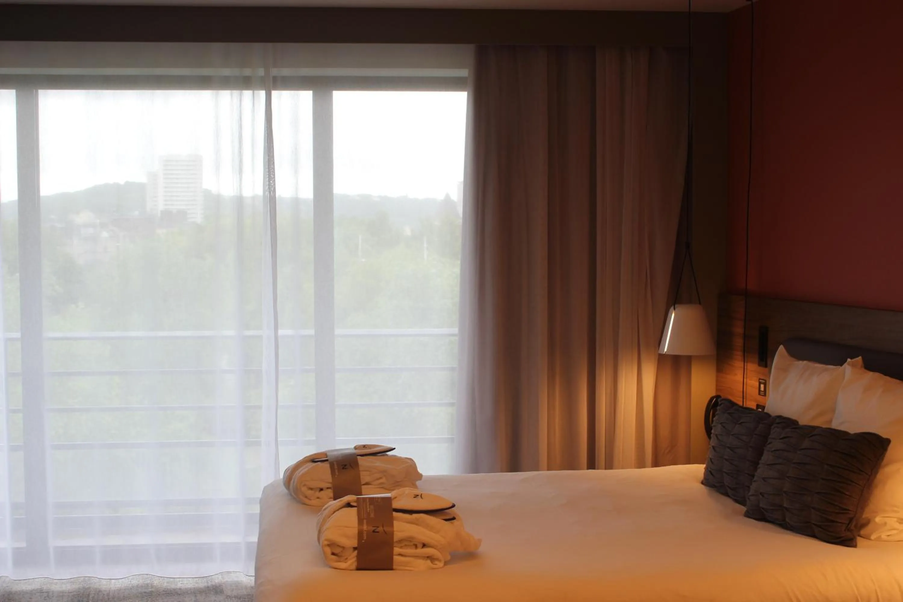 Bed in Novotel Suites Rouen Normandie