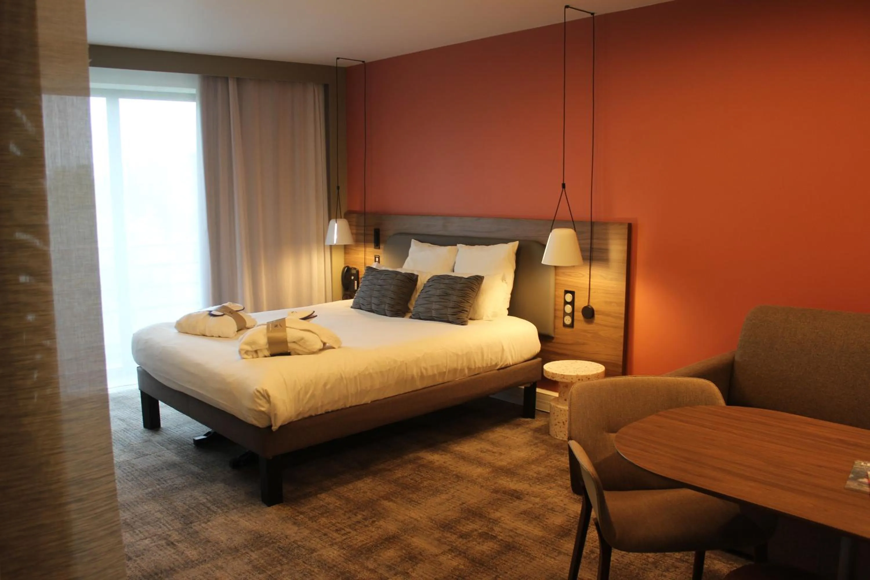 Bed in Novotel Suites Rouen Normandie