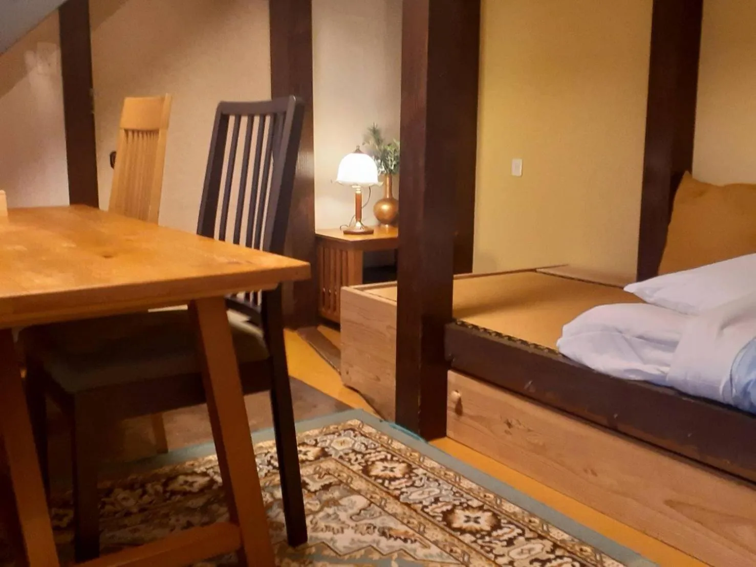 Bed in HAKUBA IKEDA LIFE KAN APARTMENTS