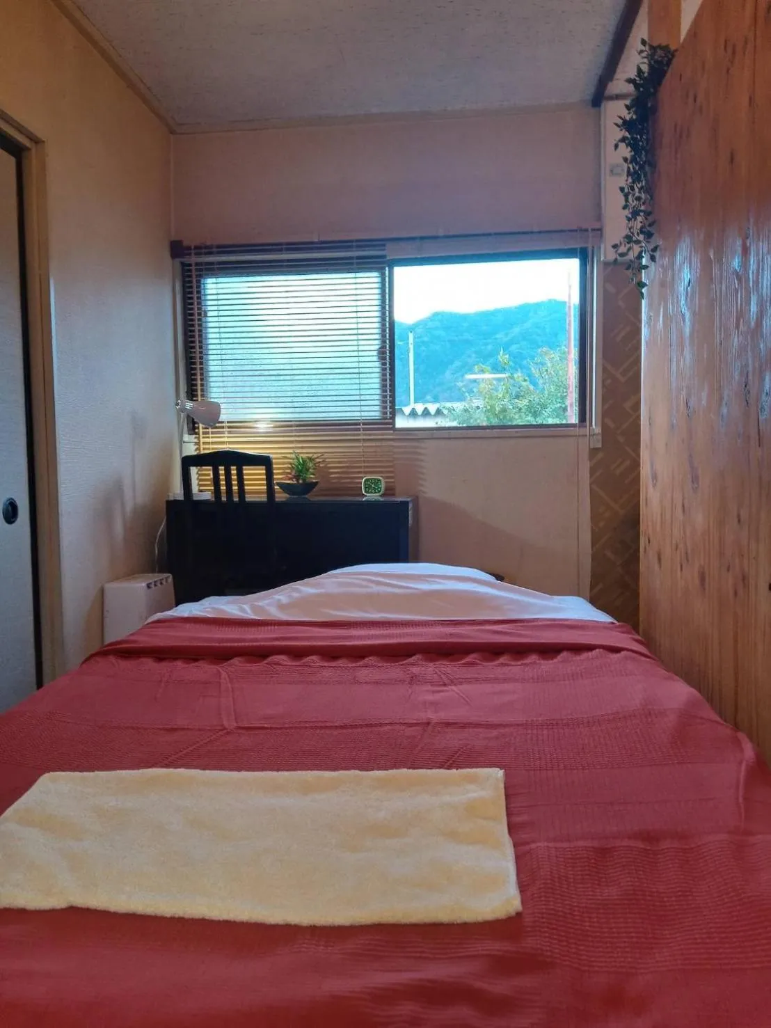 Bed in HAKUBA IKEDA LIFE KAN APARTMENTS