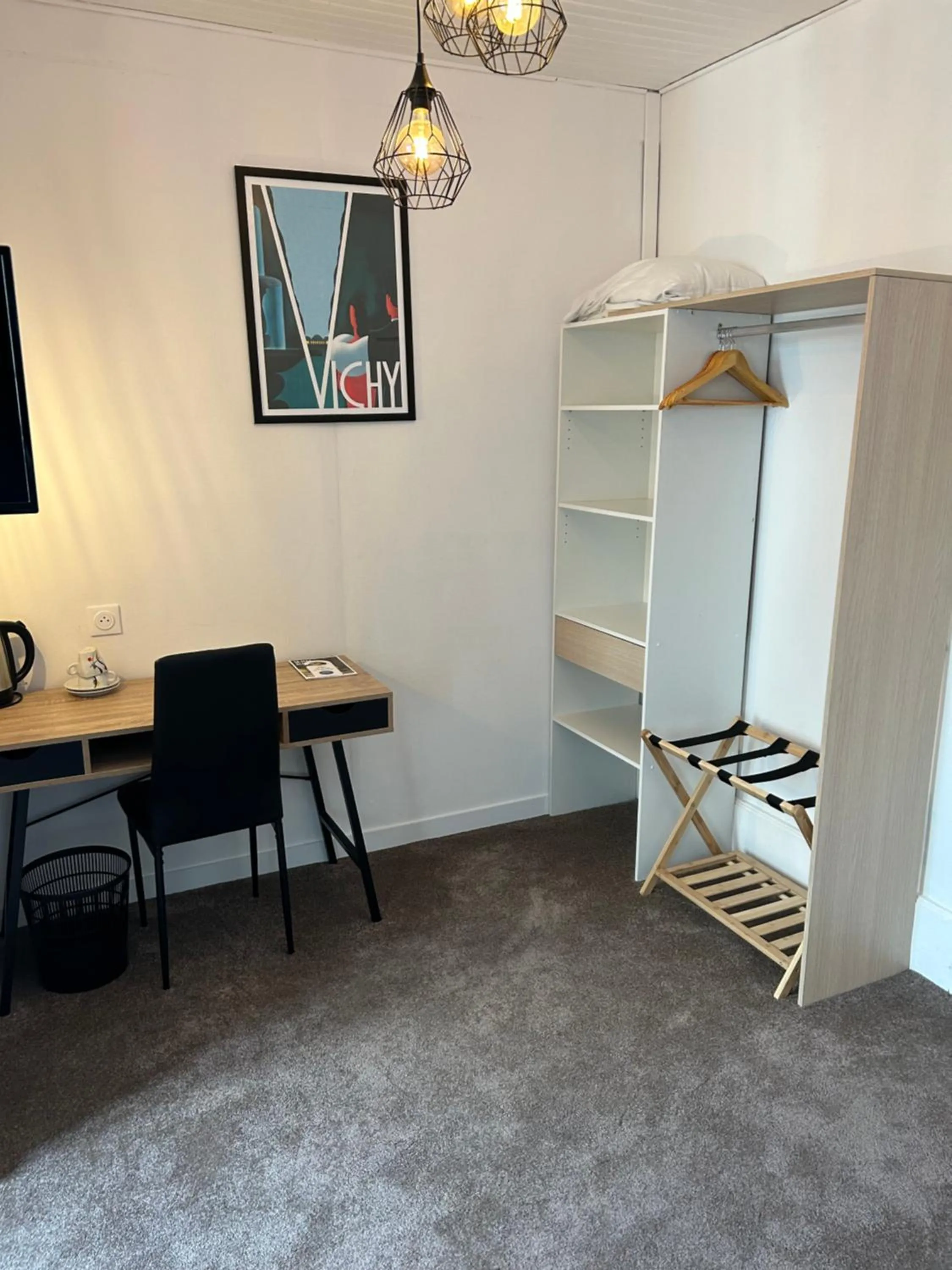 Bedroom in Hôtel & Restaurant Le Patio VICHY