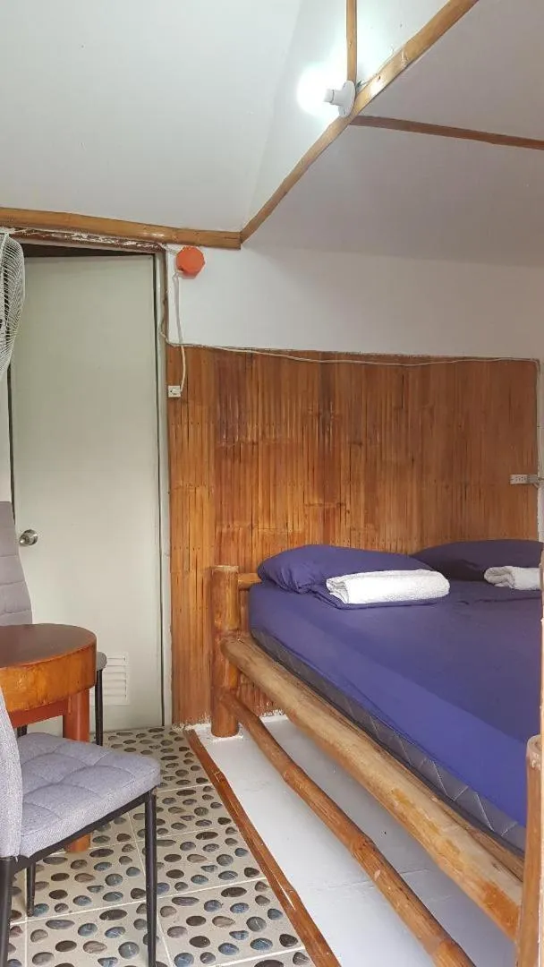 Bed in Nirvana Bamboo & Dive resort