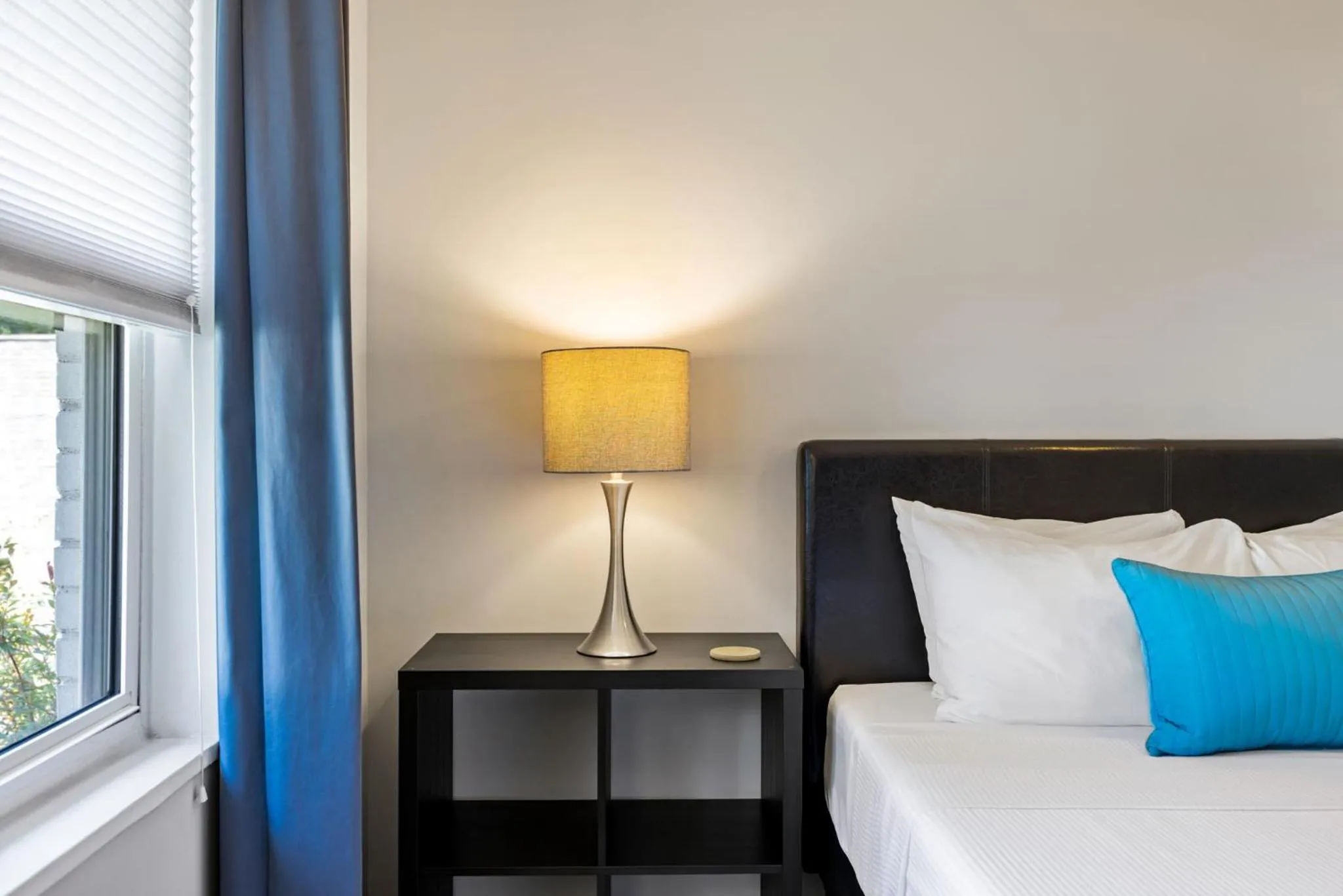 Bed in Brookwood Courtyard by BCA Furnished Apartments