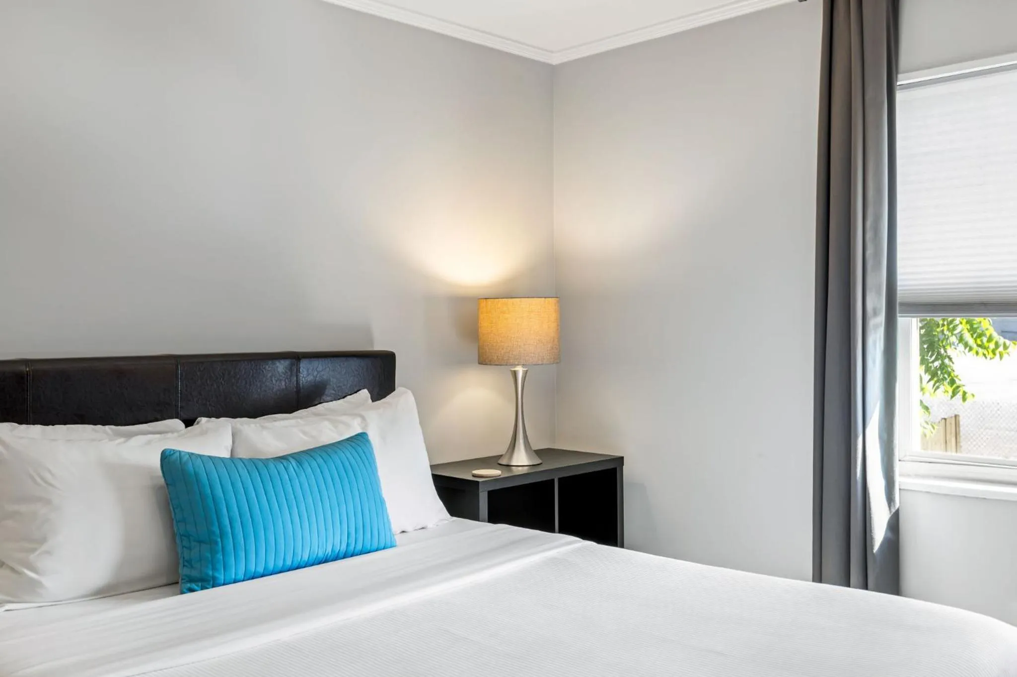 Bed in Brookwood Courtyard by BCA Furnished Apartments