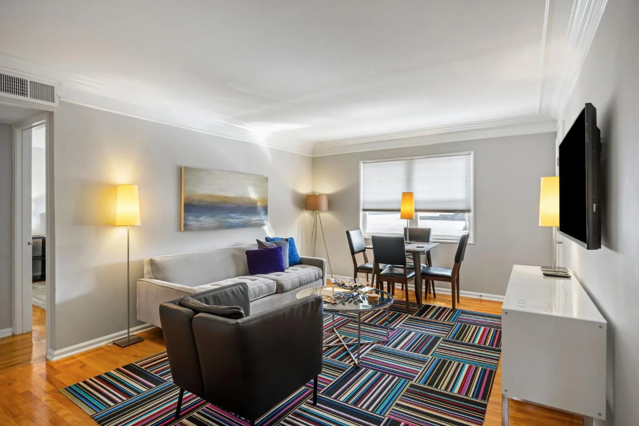 Communal lounge/ TV room in Brookwood Courtyard by BCA Furnished Apartments