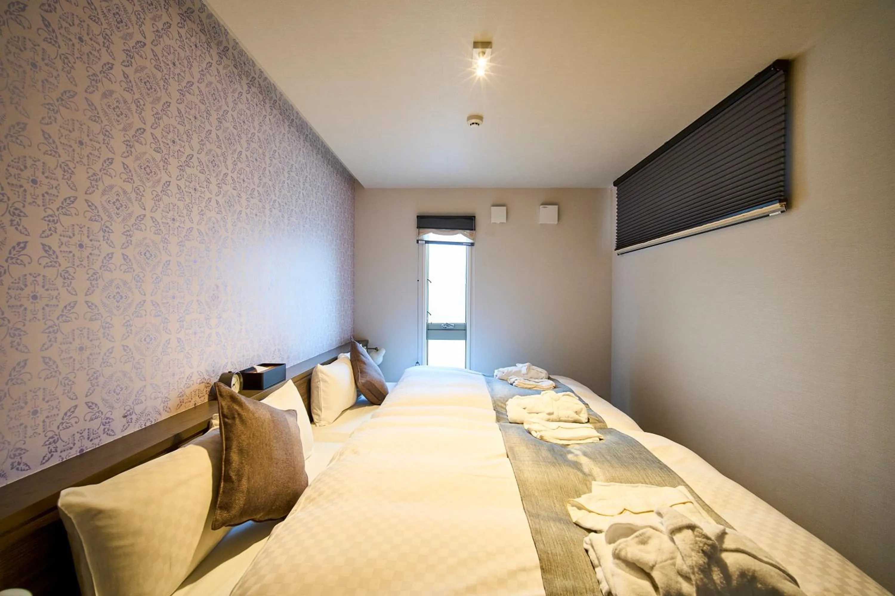 Bed in HOTEL MASTAY jingumichi