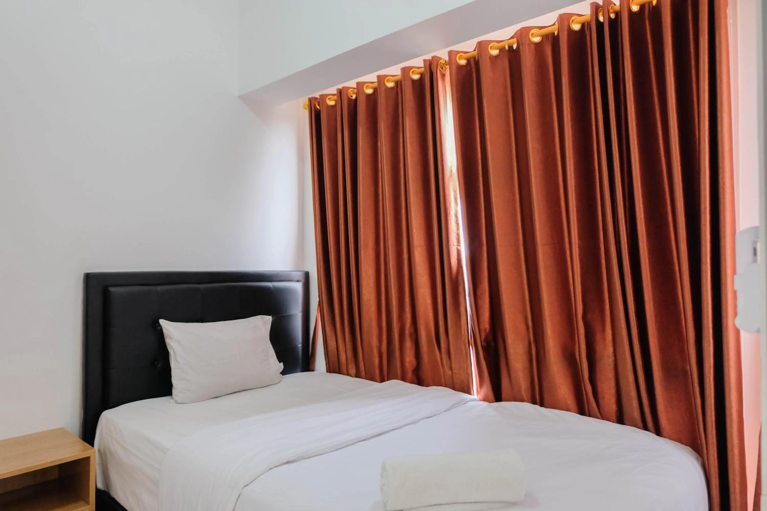 Bedroom, Bed in Comfortable 2BR Apartment at M-Town Residence By Travelio