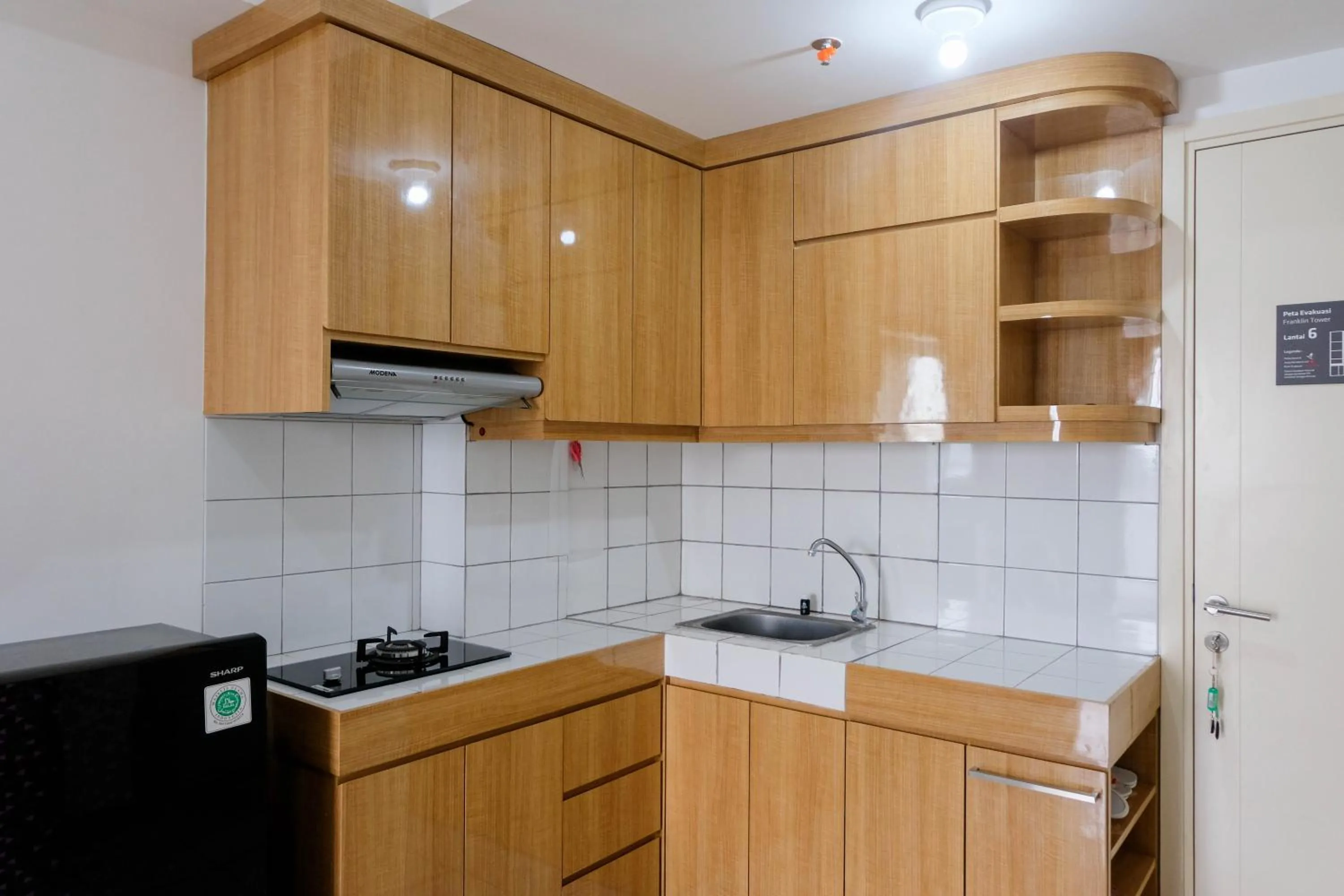 Kitchen or kitchenette in Comfortable 2BR Apartment at M-Town Residence By Travelio