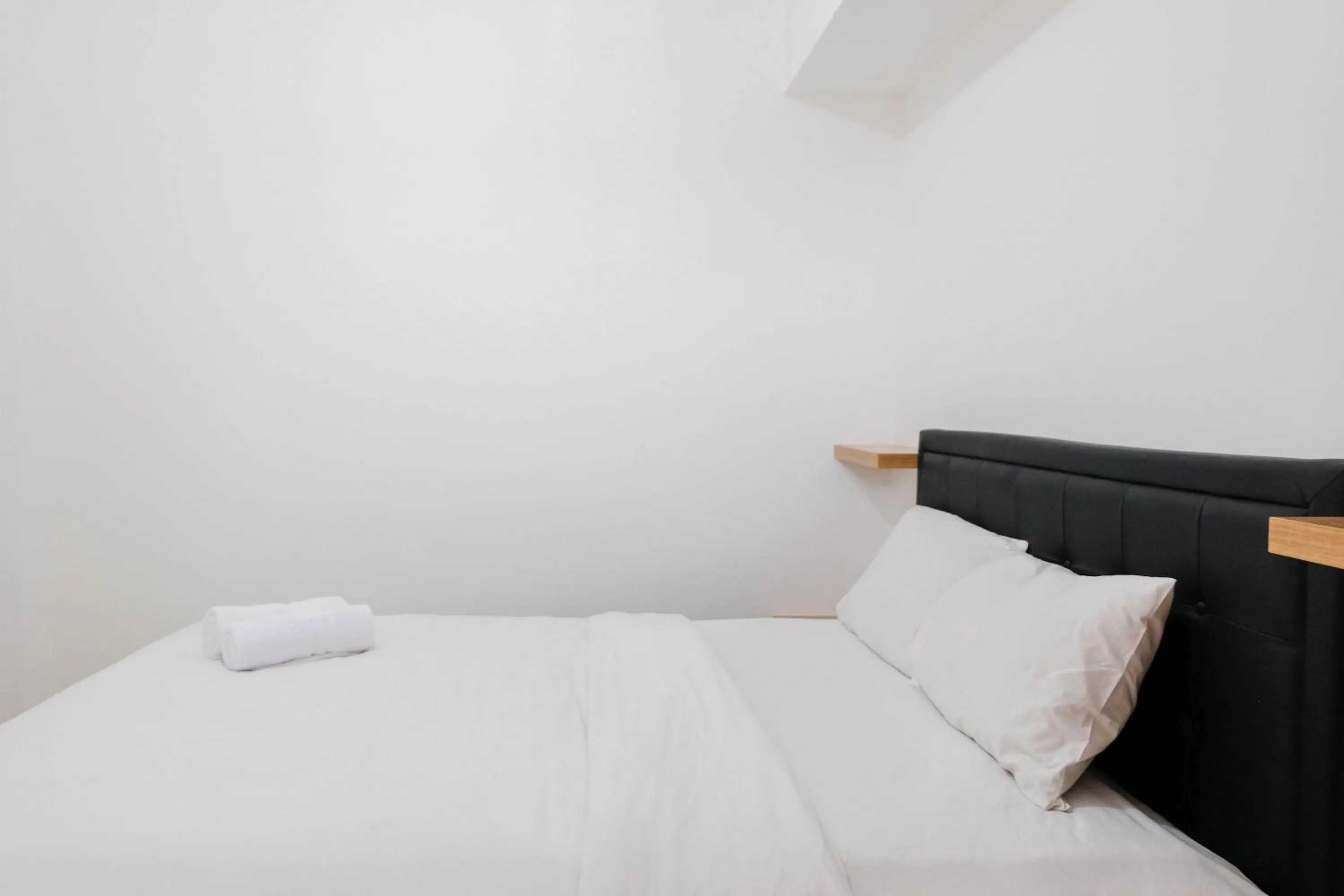 Bed in Comfortable 2BR Apartment at M-Town Residence By Travelio