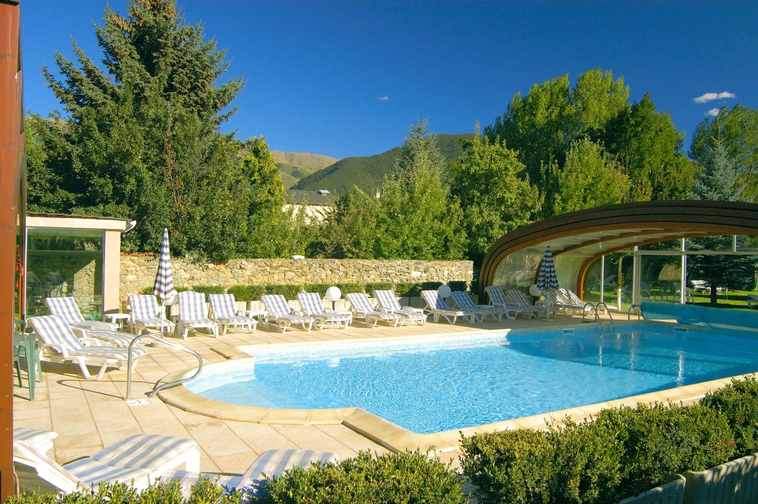 Swimming pool in Logis Hotel Restaurant Planes