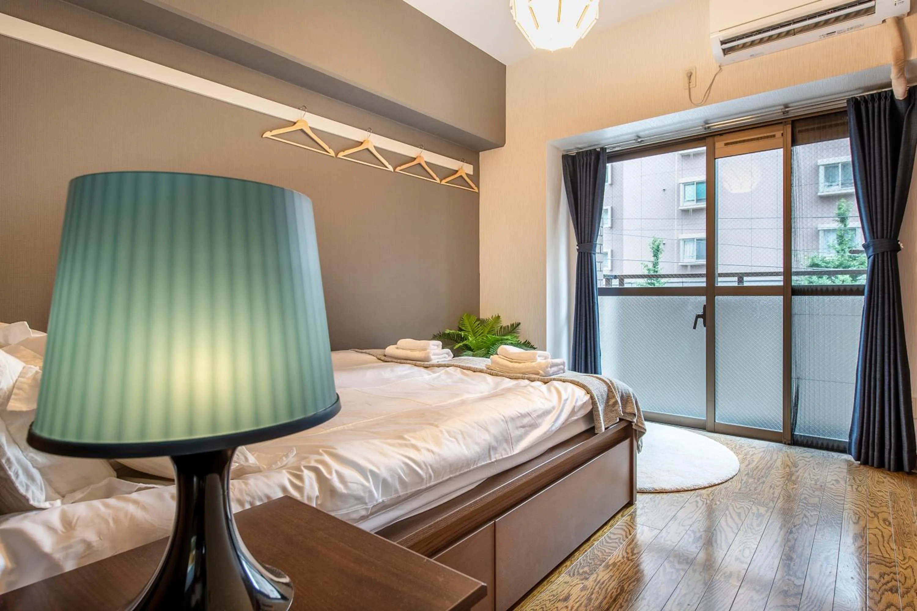 Bed in Uhome Akihabara Apartment 3