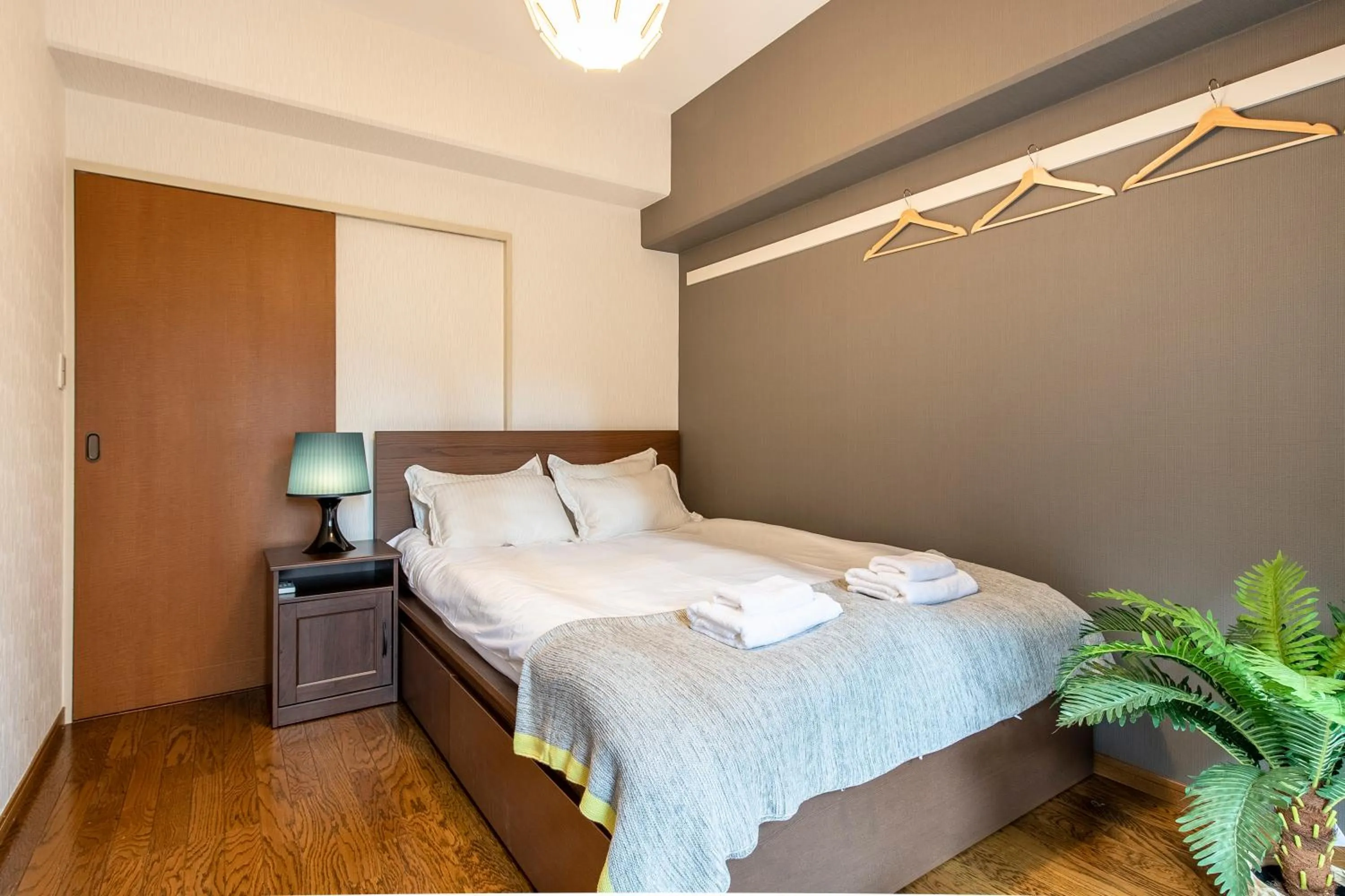 Bed in Uhome Akihabara Apartment 3