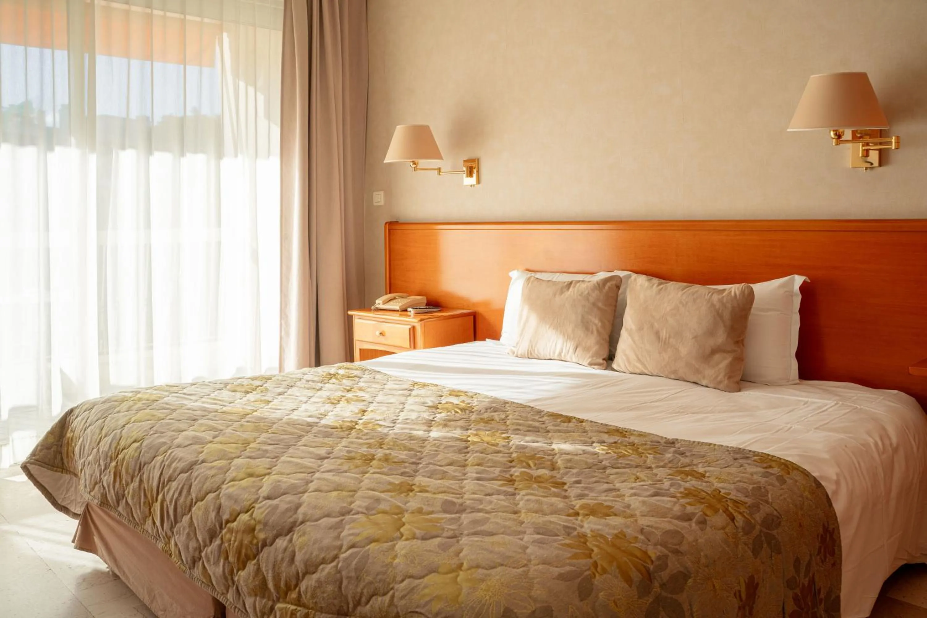 Bed in Logis Hotel Diana