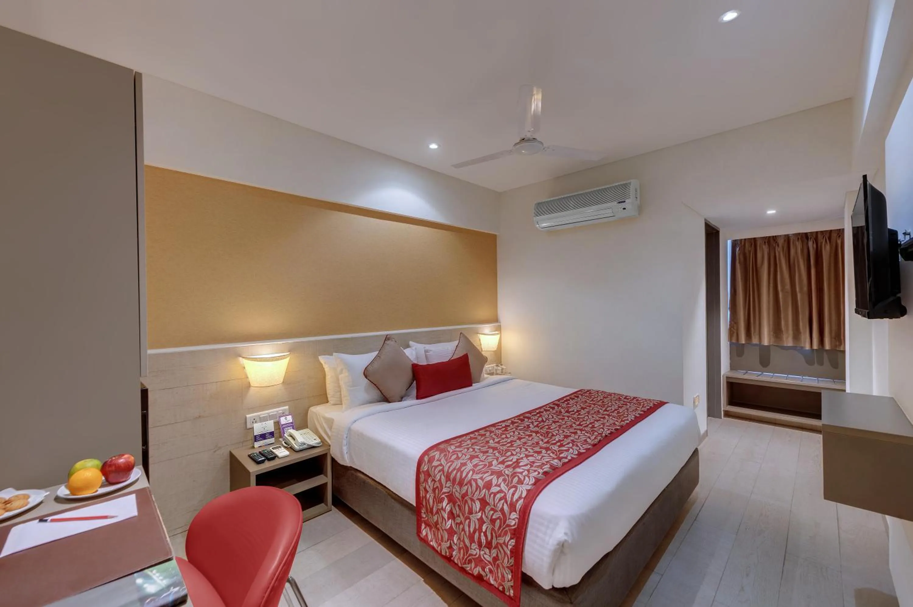 air conditioner, Bed in Click Hotel Vadodara 4 mins walk for the Railway Station