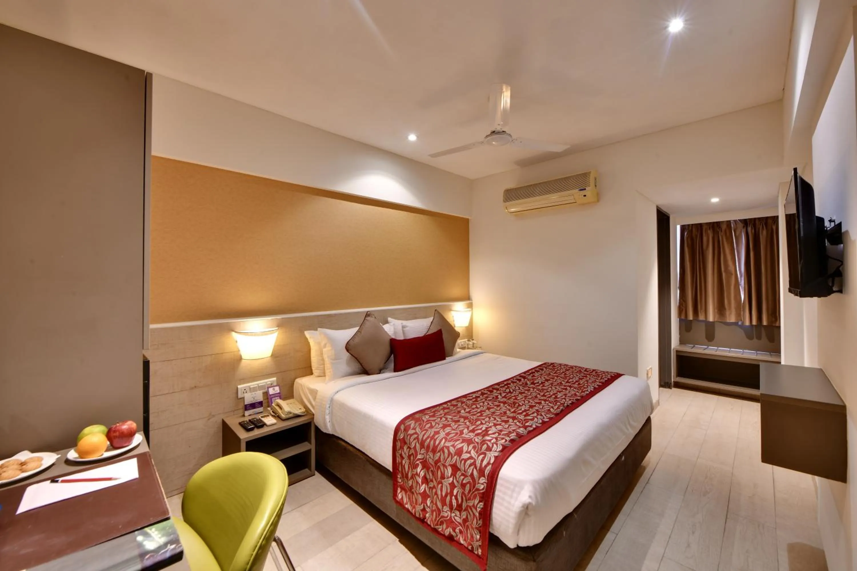 Photo of the whole room, Bed in Click Hotel Vadodara 4 mins walk for the Railway Station