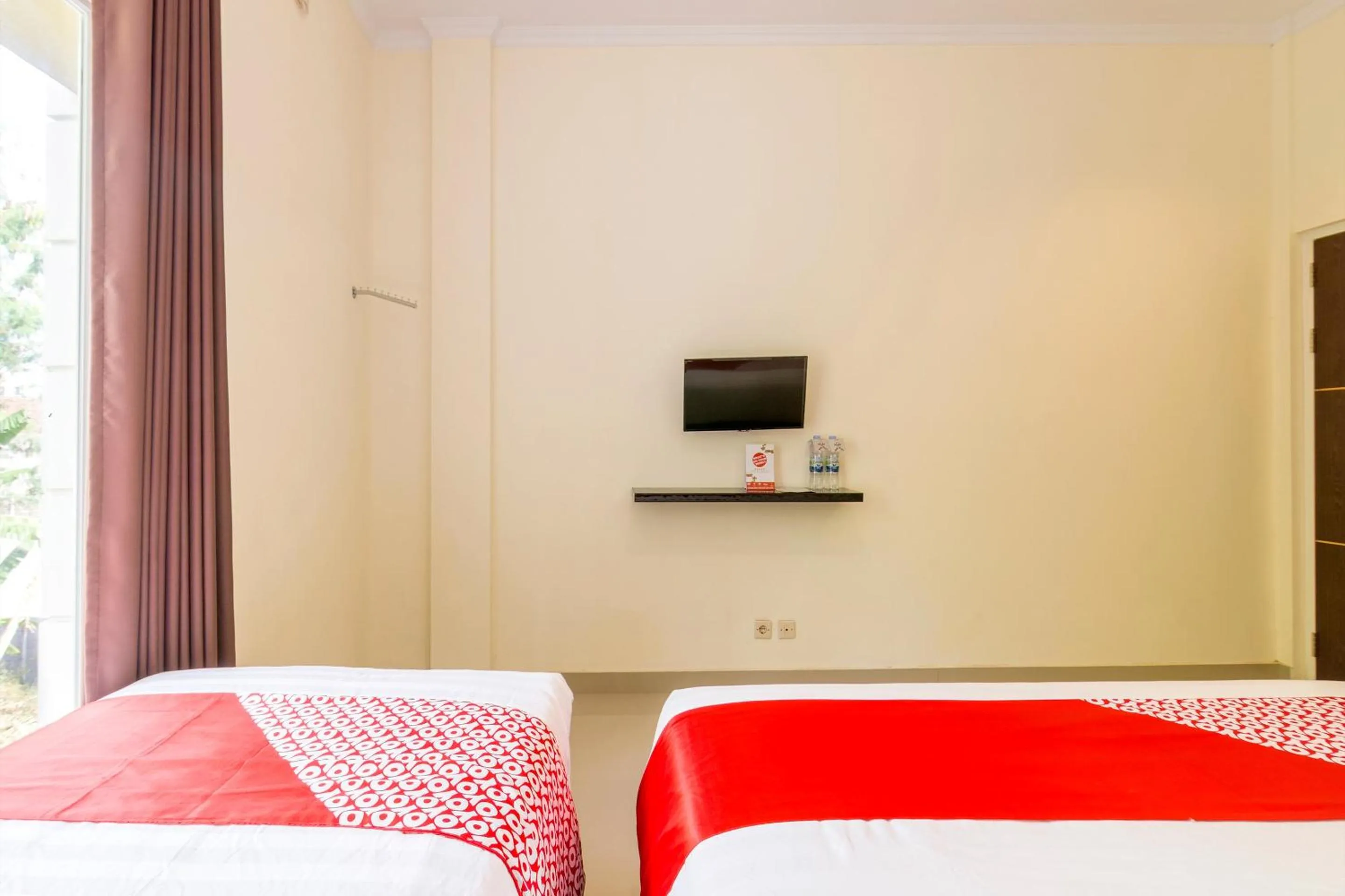 Bedroom in Hotel O Travel-inn