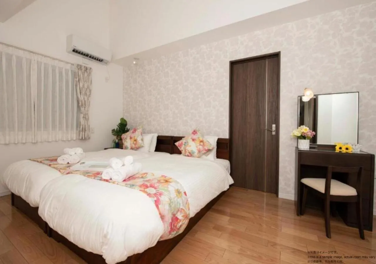 Bed in Miyakojima Villa Charles