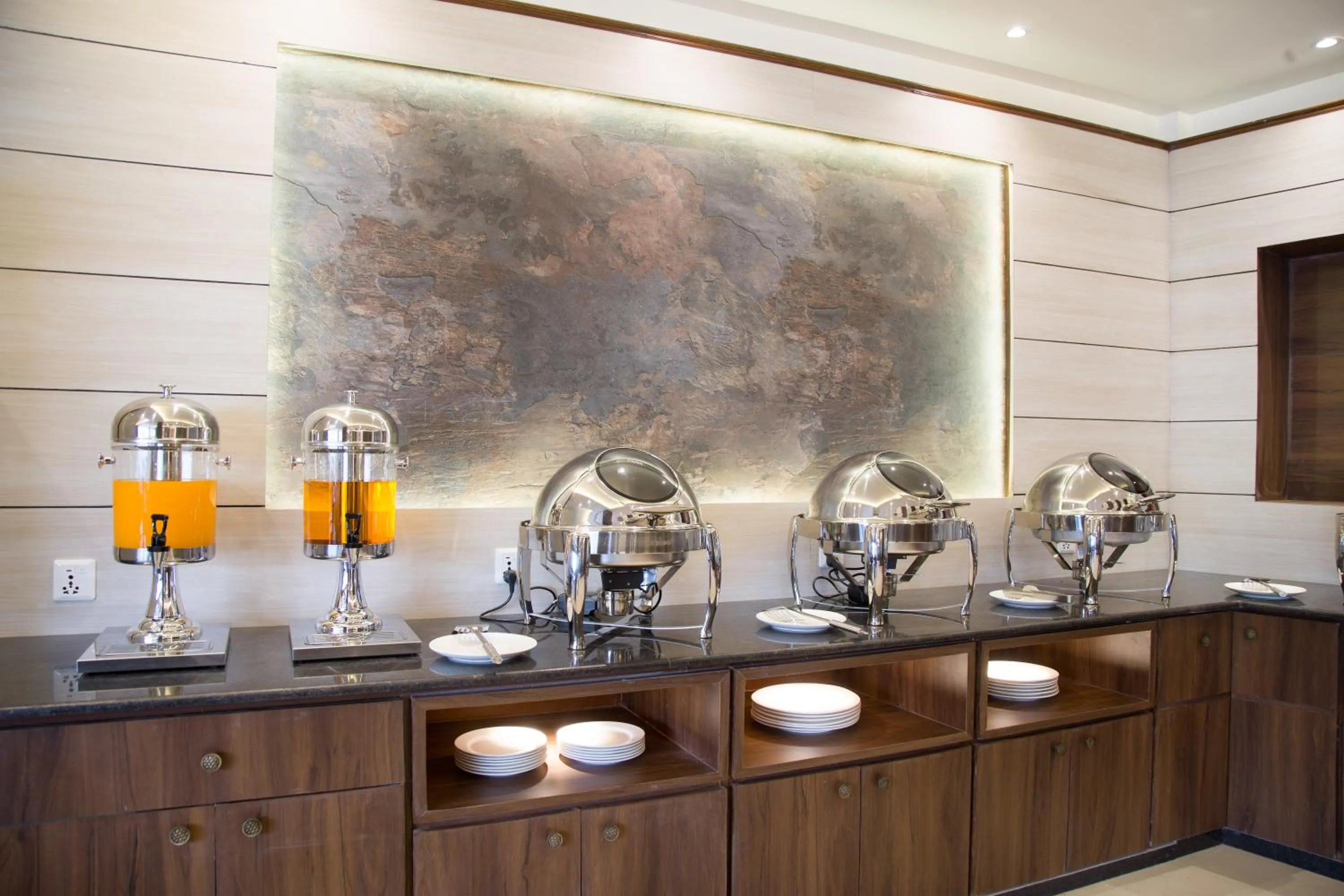 Kitchen or kitchenette in Ganapati Airport Hotel