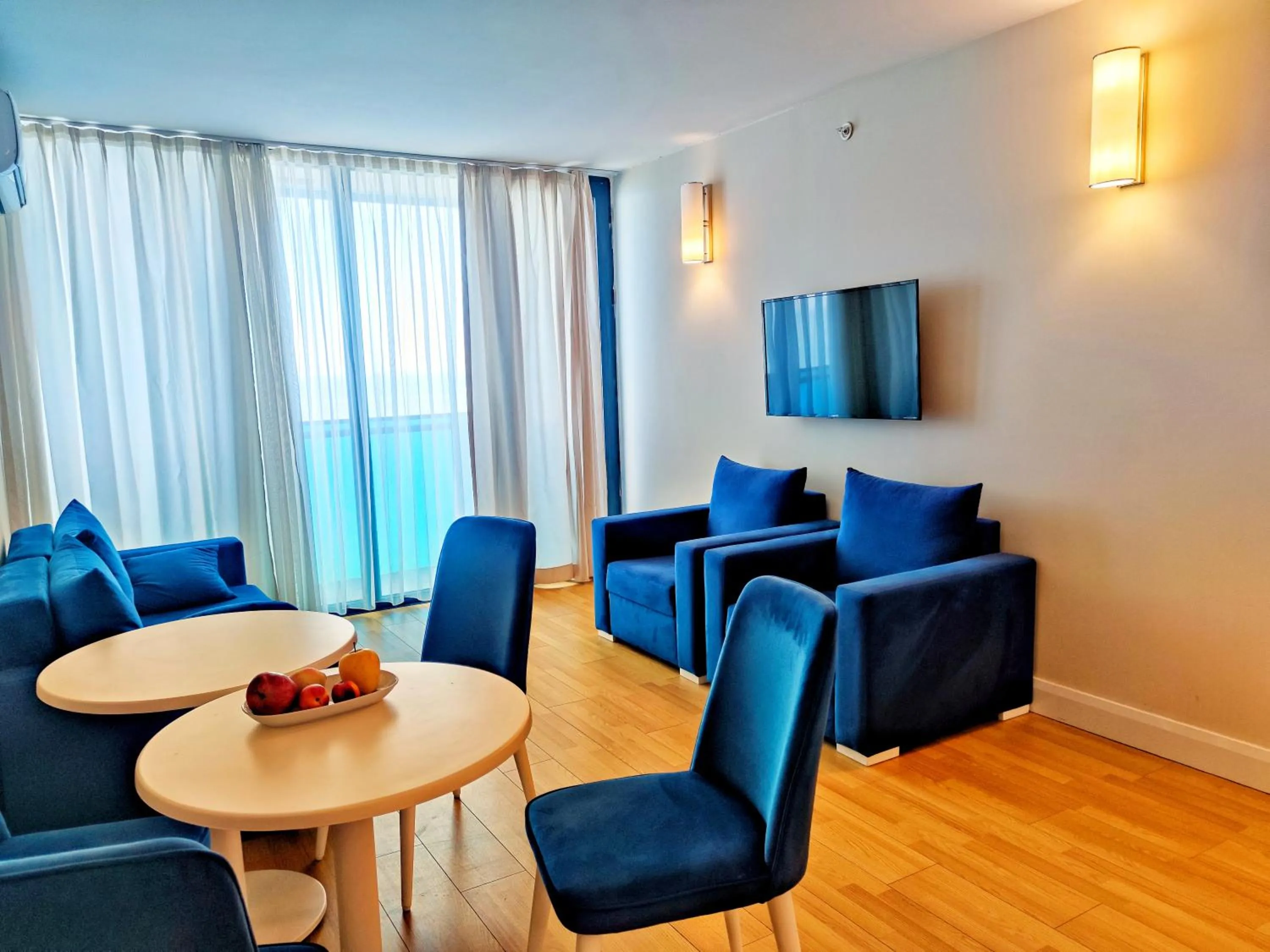 Communal lounge/ TV room, Seating Area in Orbi City Inn