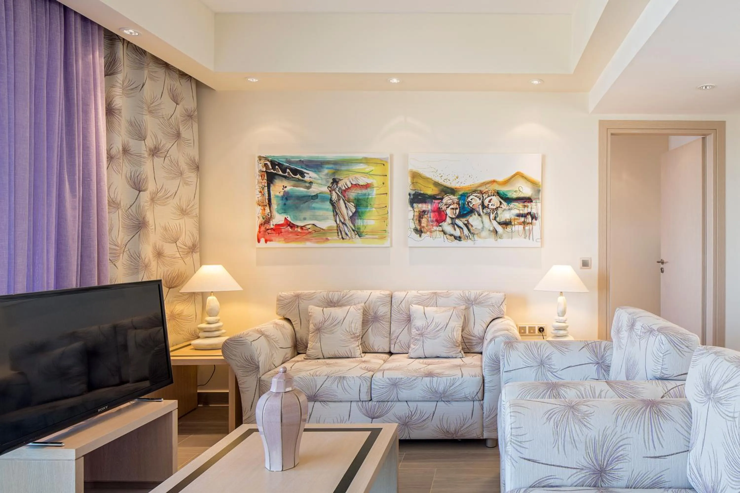 Communal lounge/ TV room in Princess Kyniska Suites