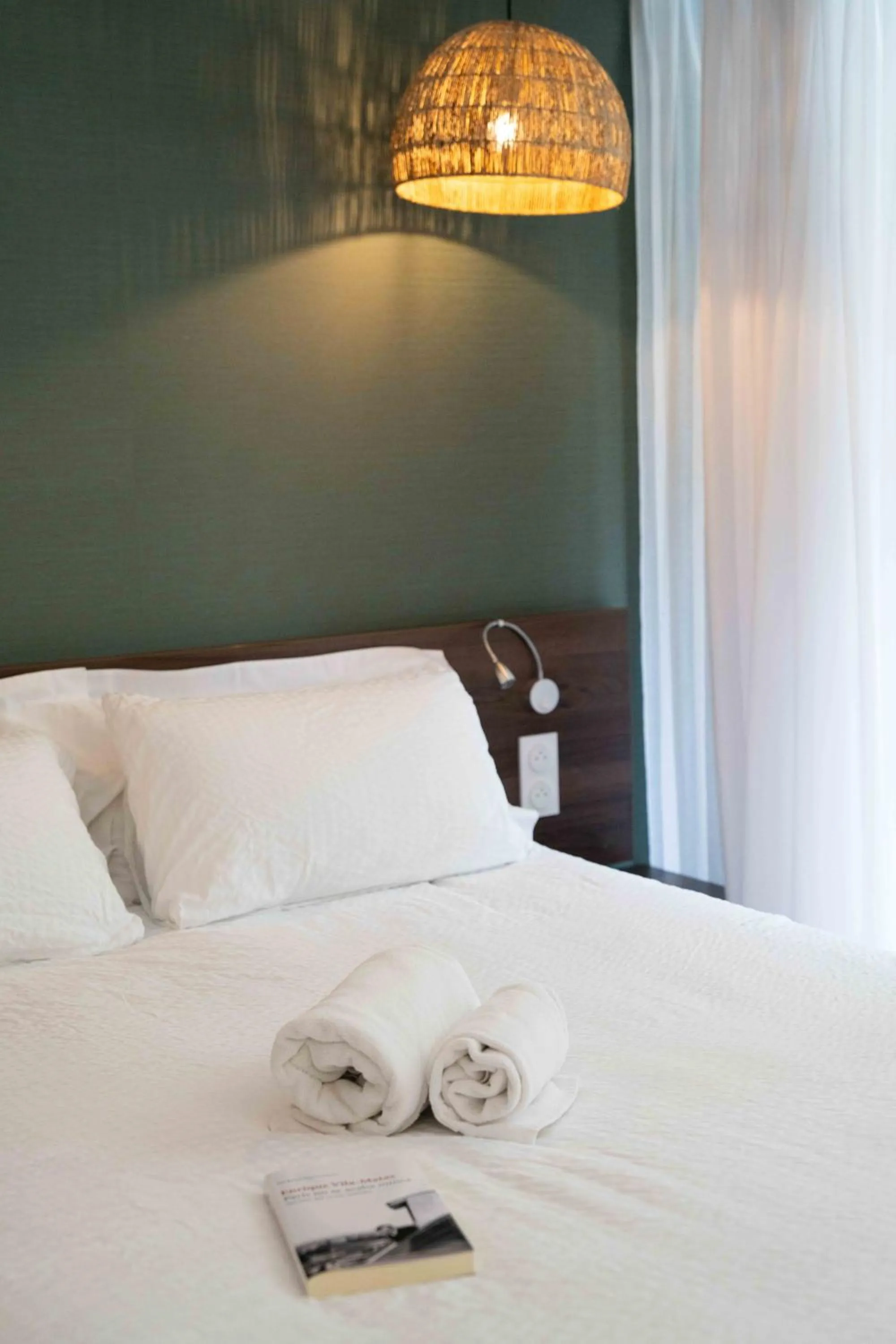 Bed in Hotel Logis Lacotel