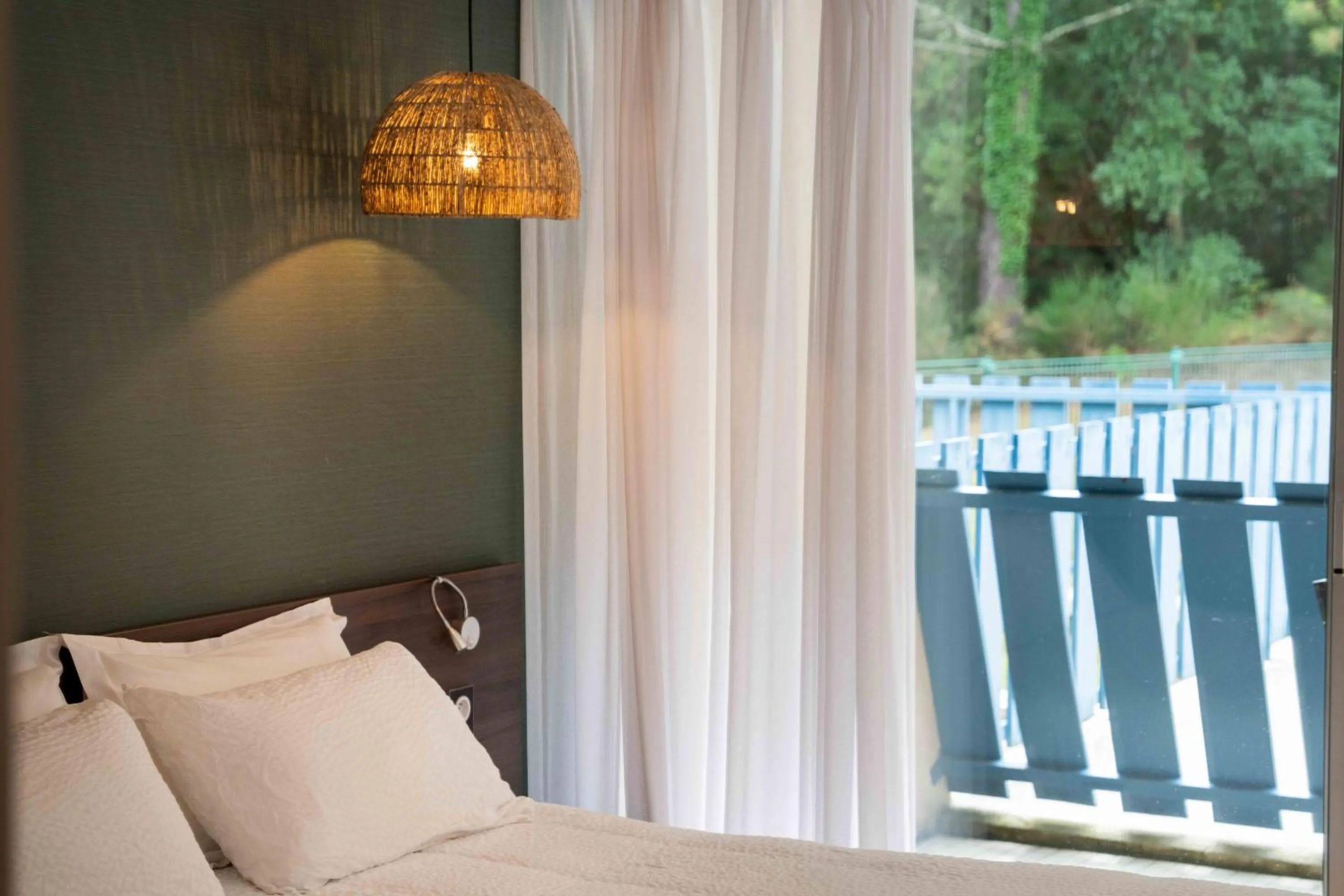 Bed in Hotel Logis Lacotel