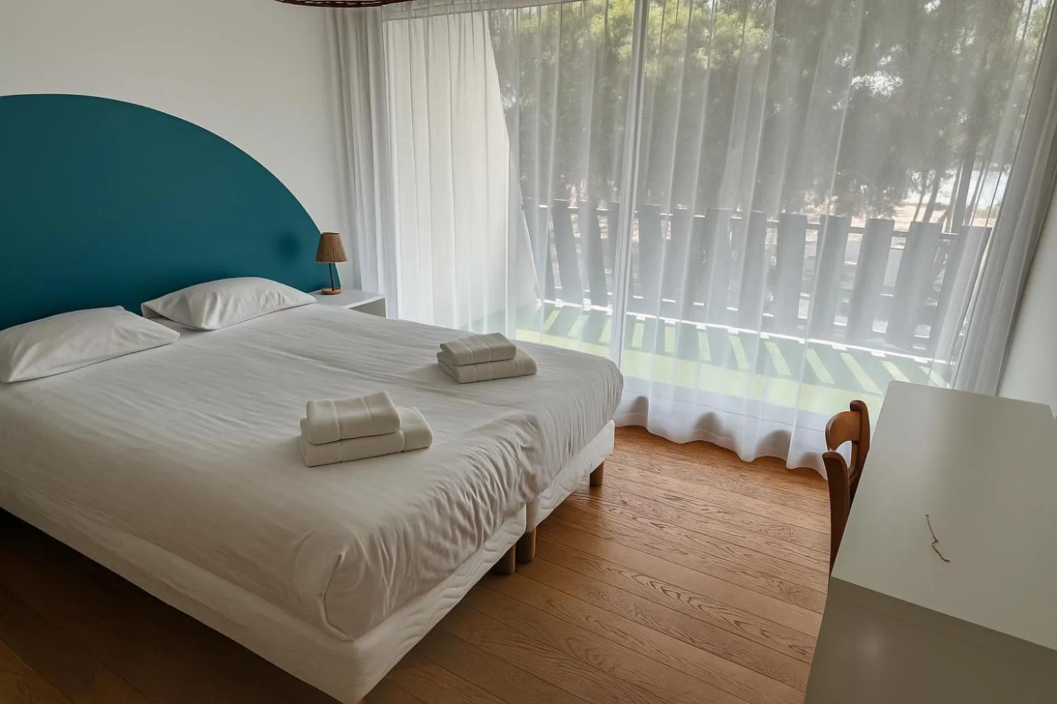 Bed in Hotel Logis Lacotel