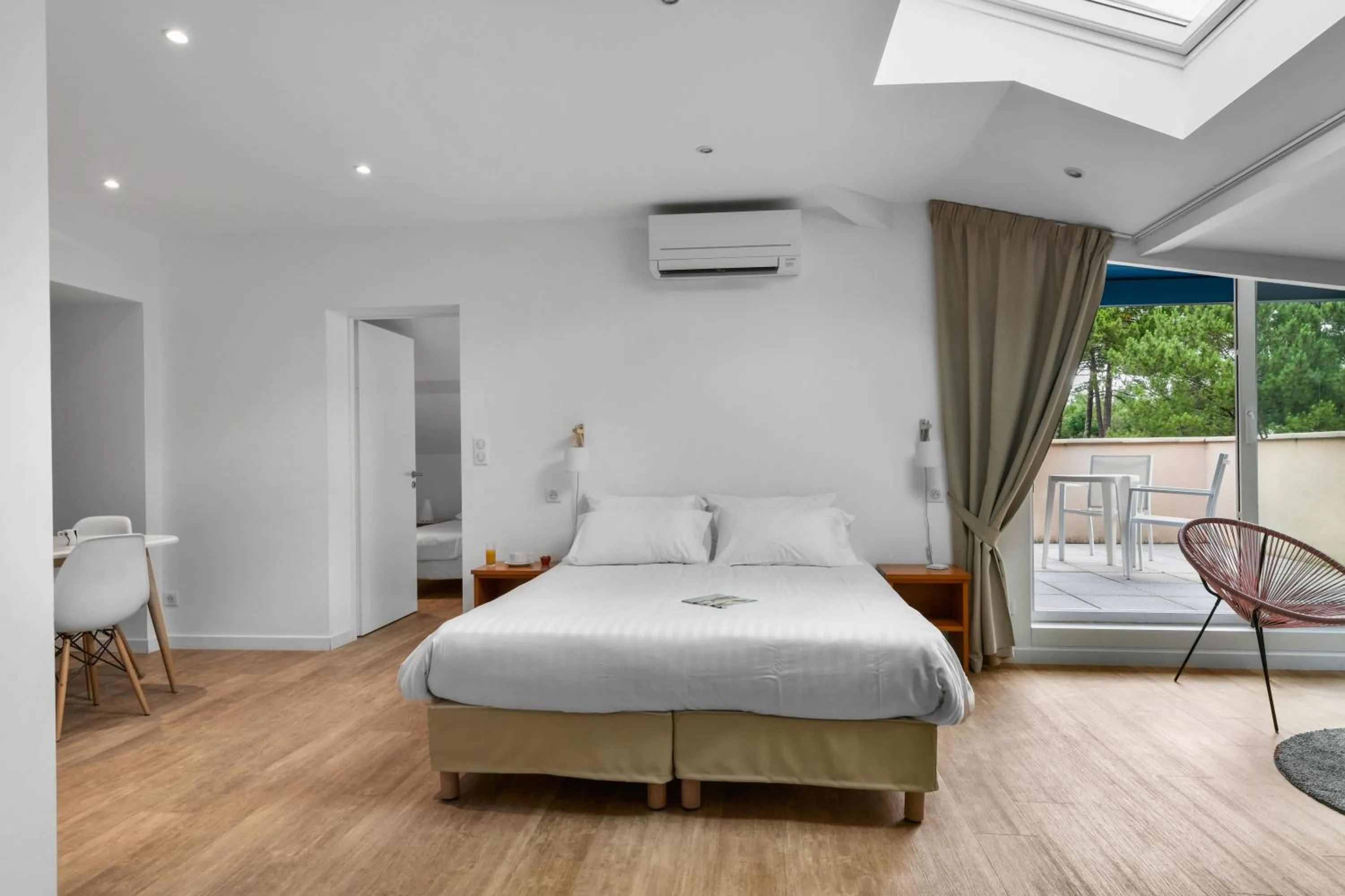 Bed in Hotel Logis Lacotel