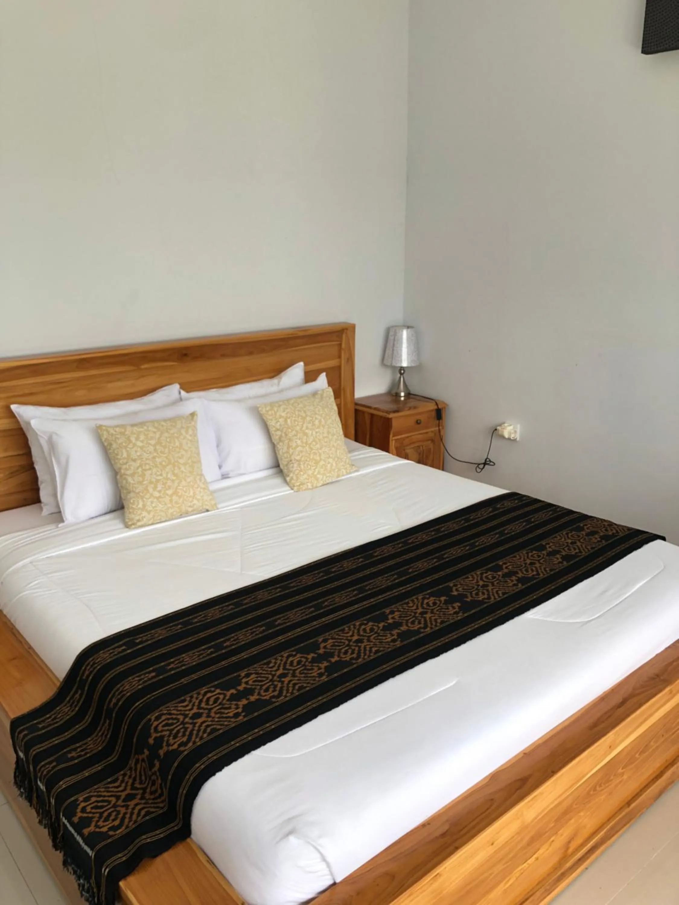 Bed in Batur Pyramid Guesthouse