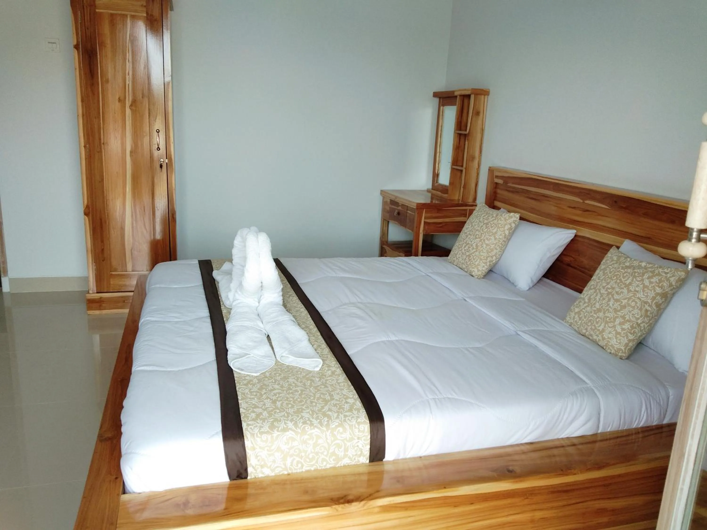 Bed in Batur Pyramid Guesthouse