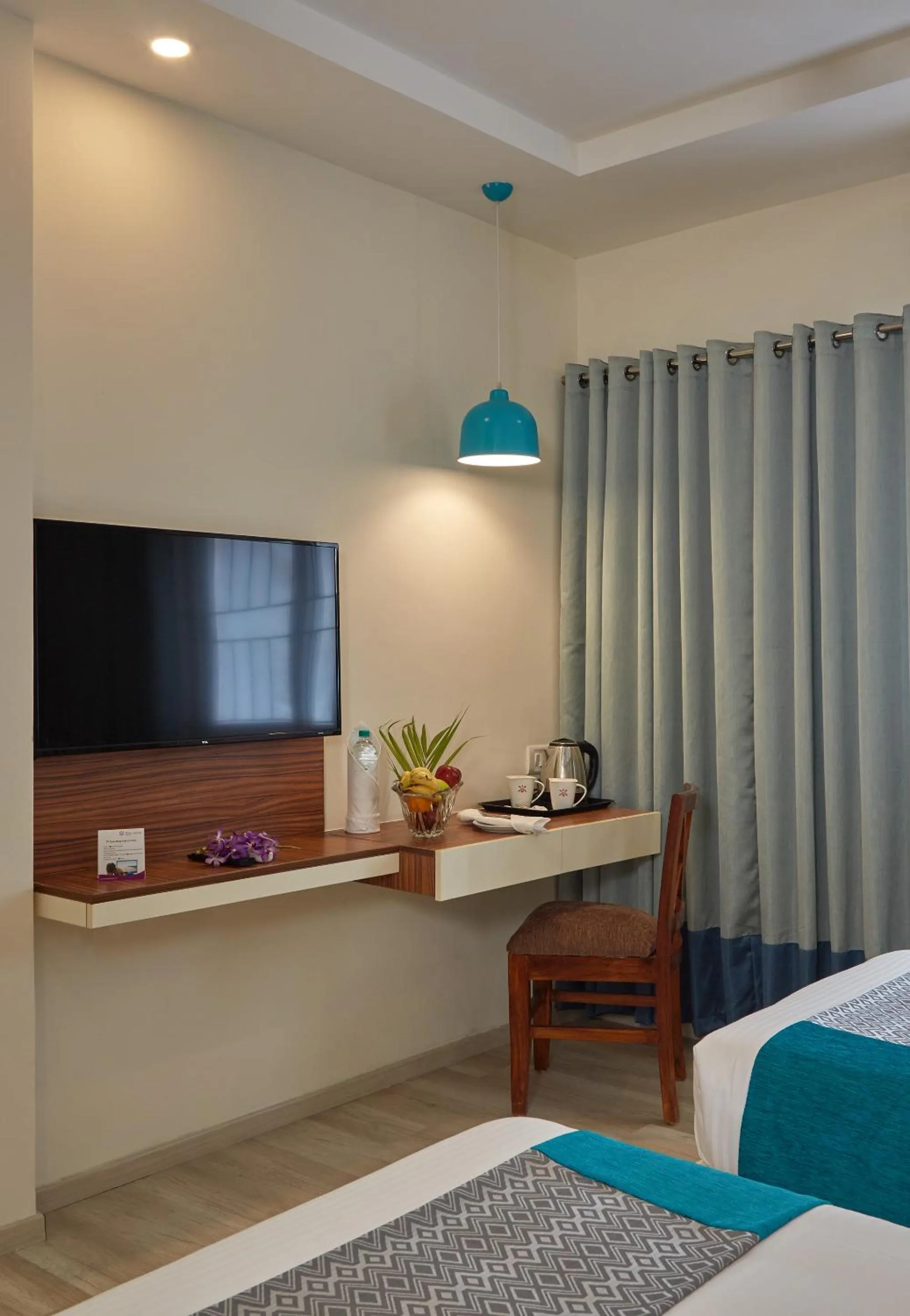TV and multimedia, Bed in Regenta Inn Indiranagar by Royal Orchid Hotels