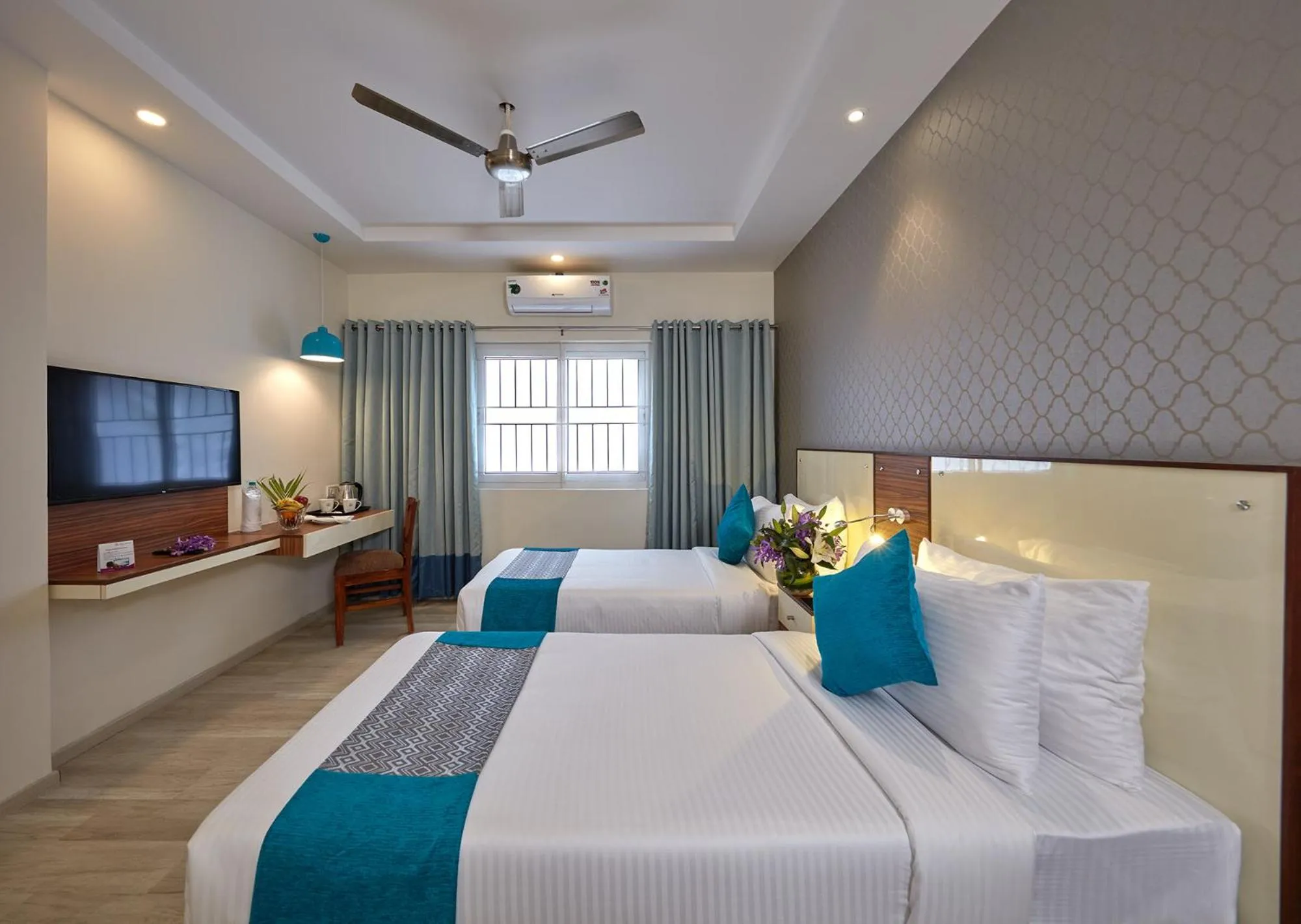 Bedroom, Bed in Regenta Inn Indiranagar by Royal Orchid Hotels