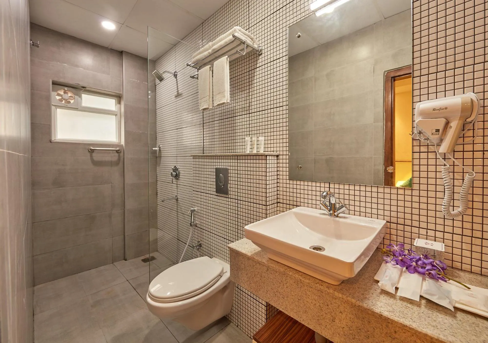 Bathroom in Regenta Inn Indiranagar by Royal Orchid Hotels