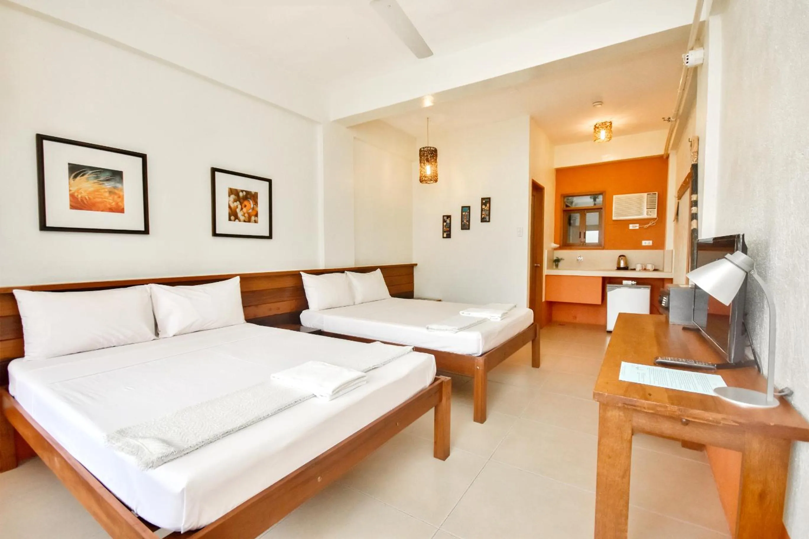 Photo of the whole room, Bed in Agos Boracay Rooms + Beds