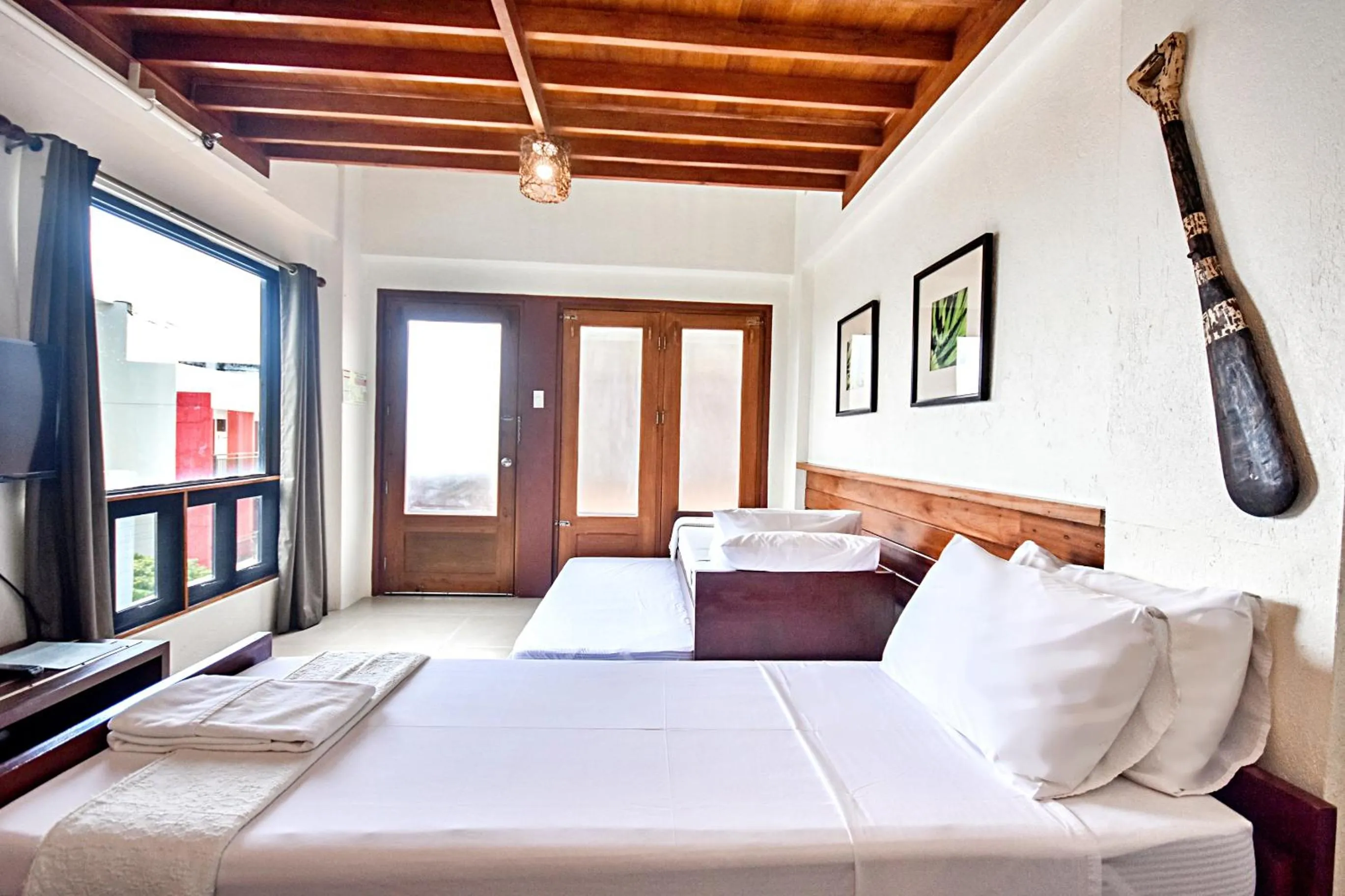 Photo of the whole room, Bed in Agos Boracay Rooms + Beds