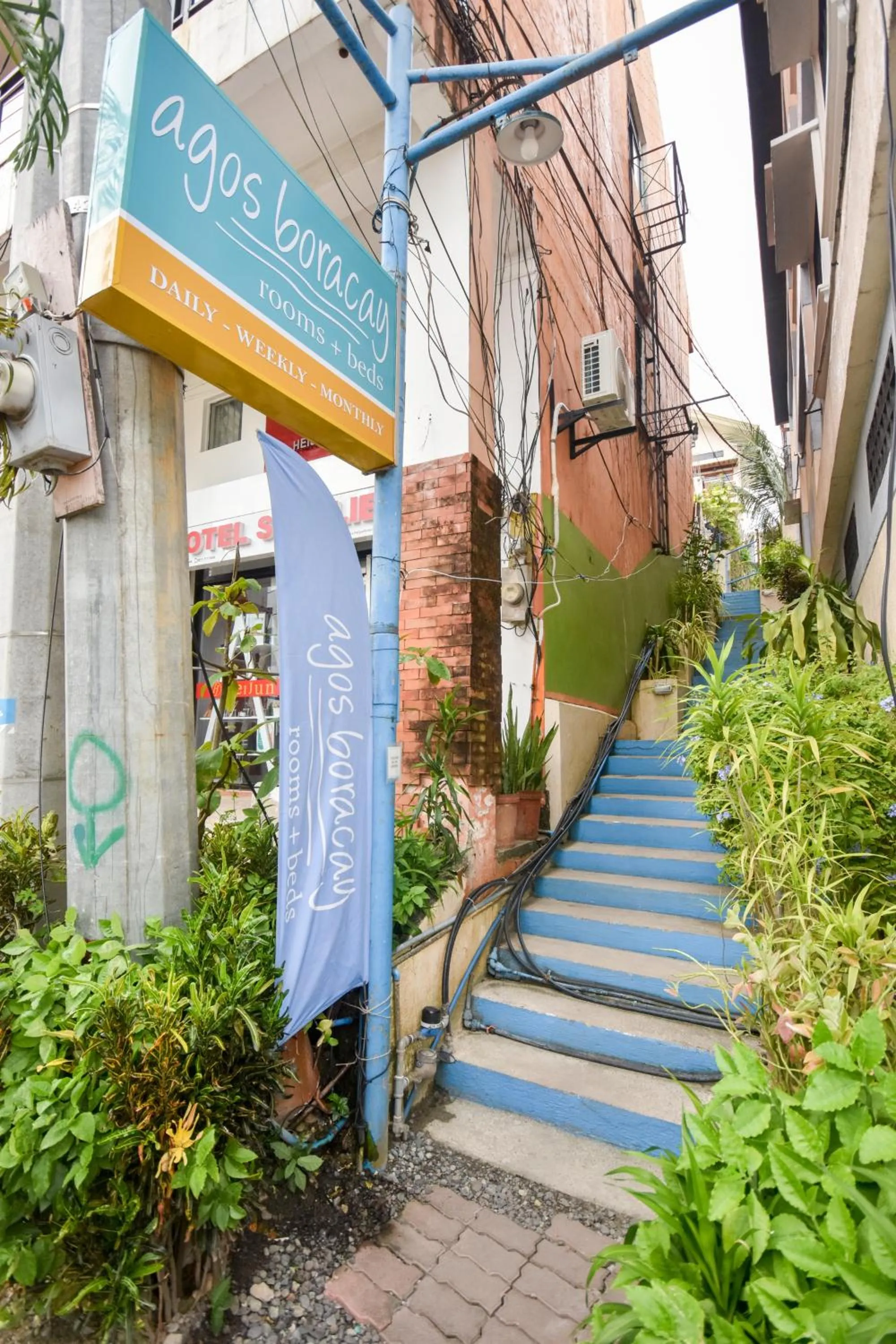 Property logo or sign in Agos Boracay Rooms + Beds