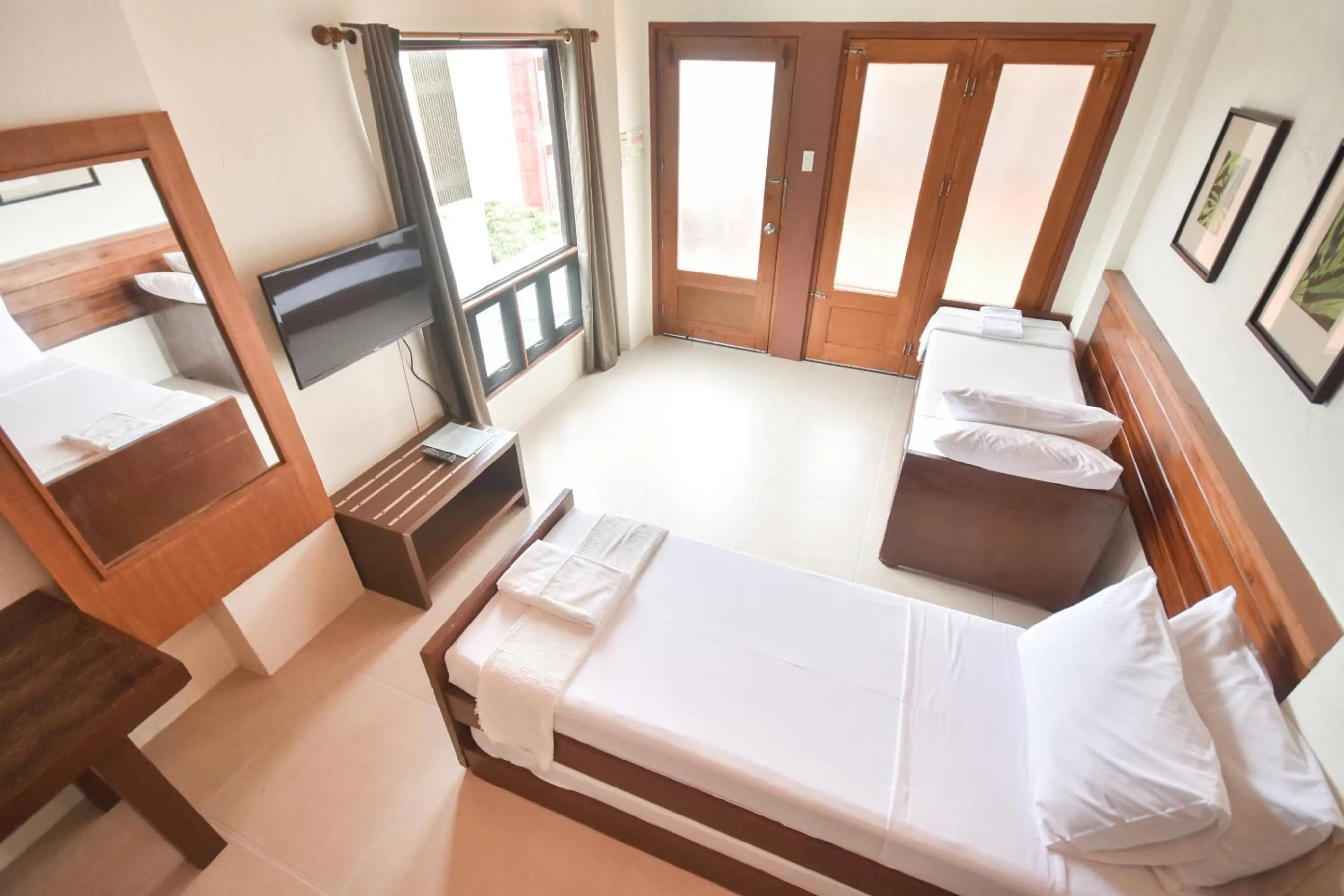 Photo of the whole room, Bed in Agos Boracay Rooms + Beds