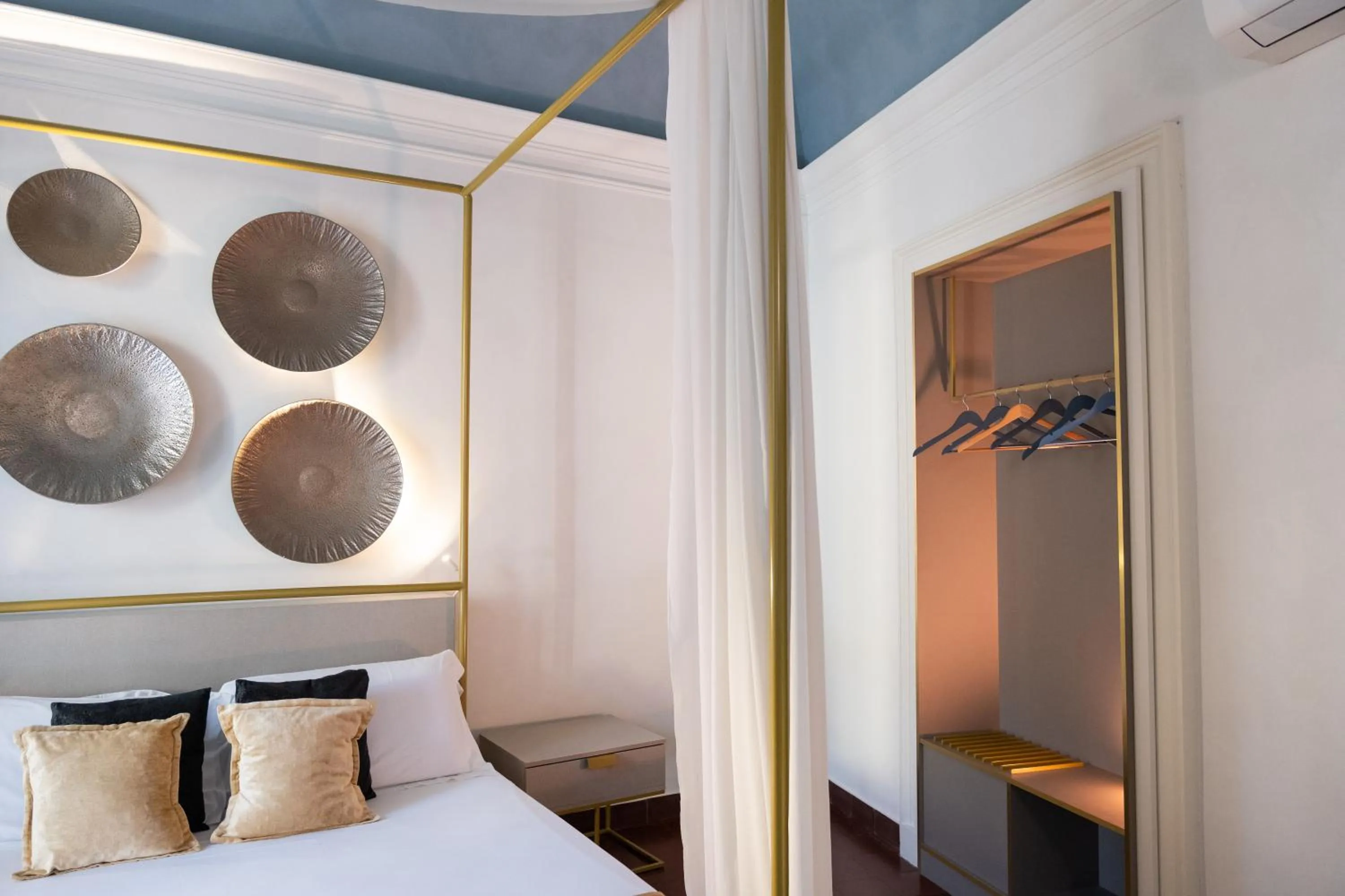 Bed in Scene Suites Apartments