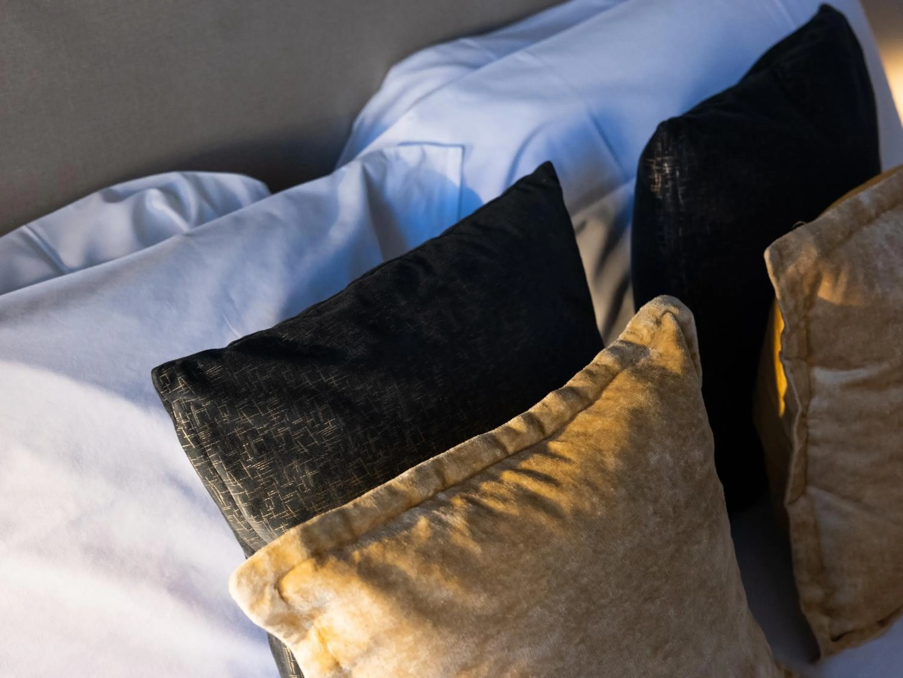 Bed in Scene Suites Apartments