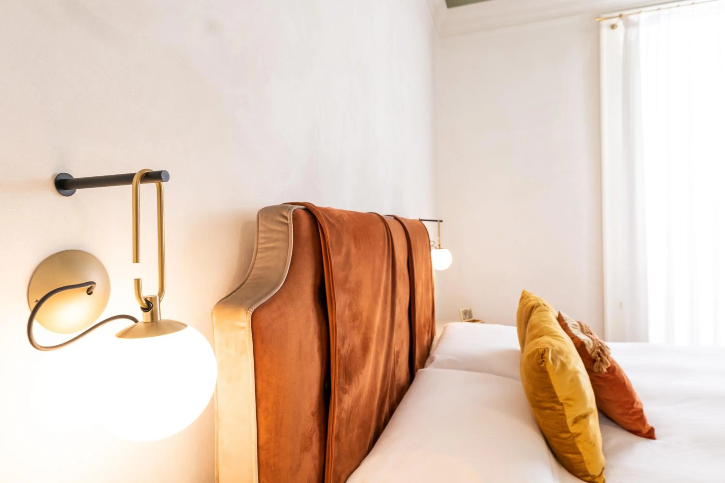 Bed in Scene Suites Apartments