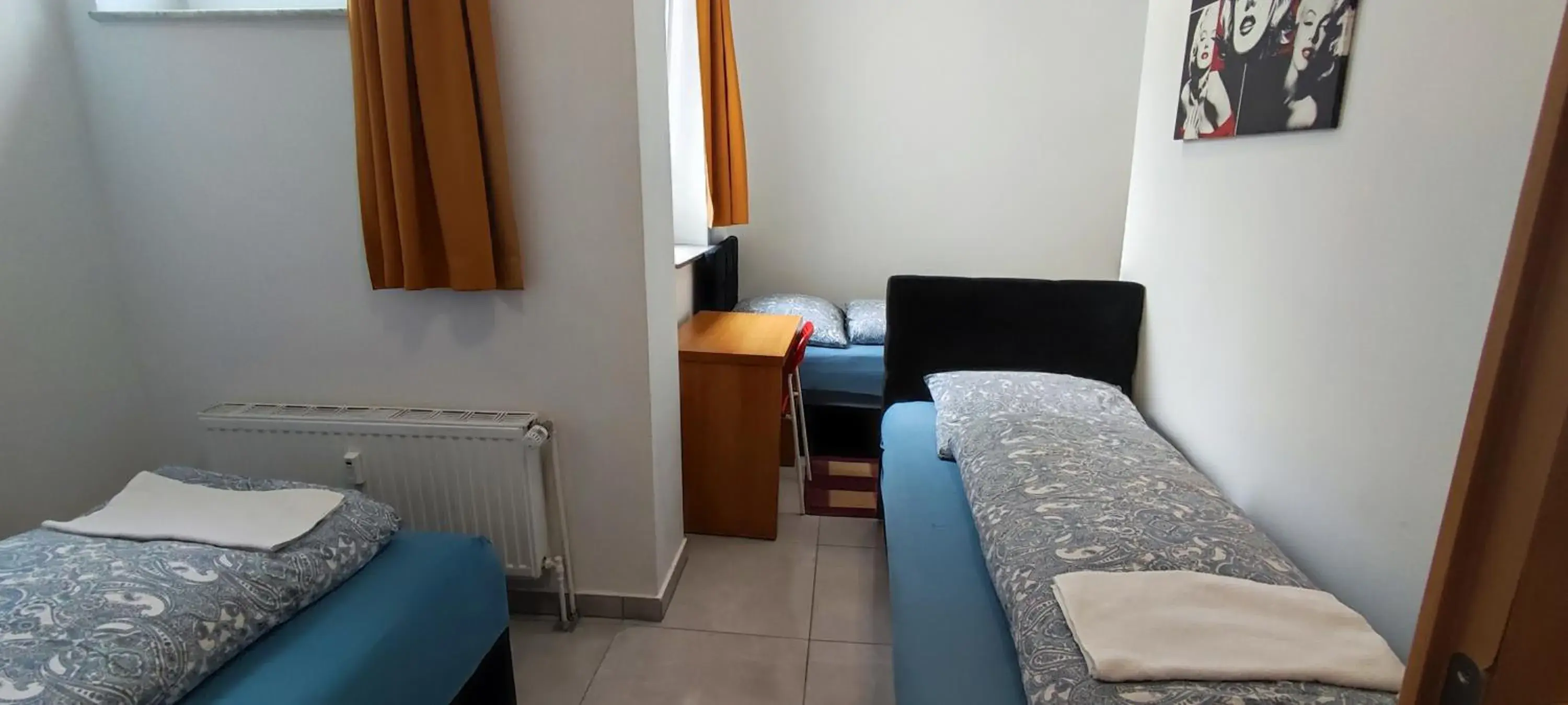 Basic Triple Room with Shared Bathroom in The Hostel Basic Triple Room with Shared Bathroom in The Hostel