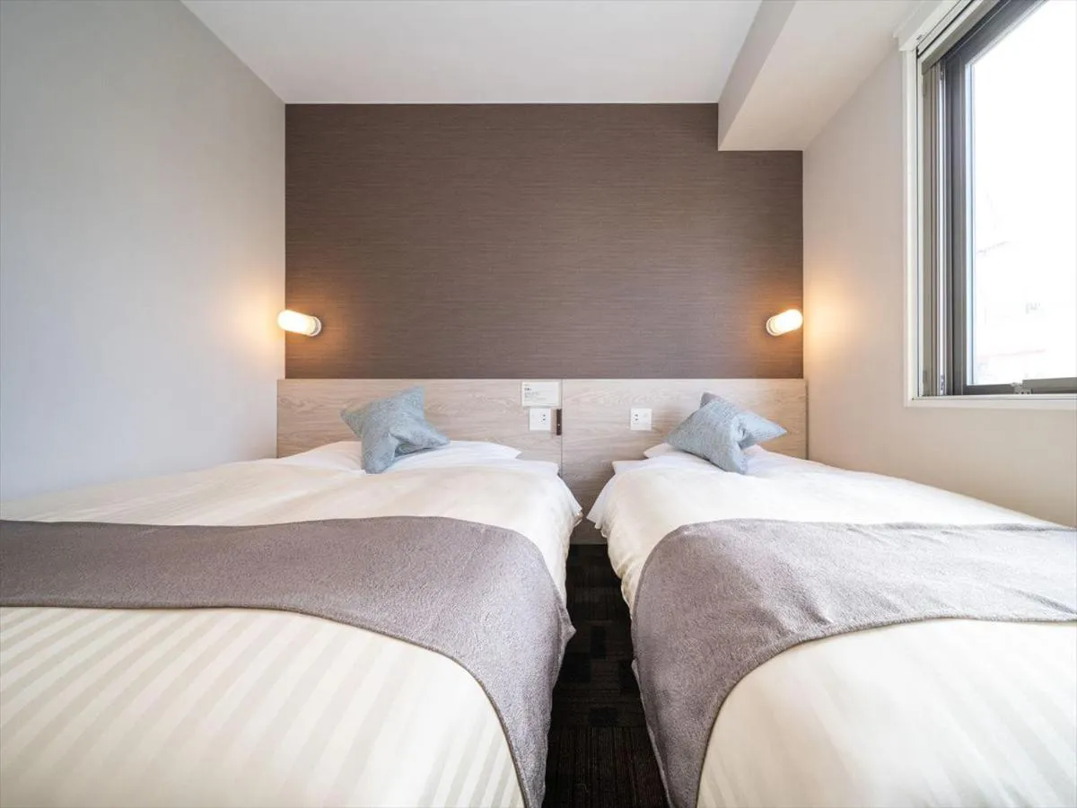 Bed in Super Hotel Premier Saitama Higashiguchi