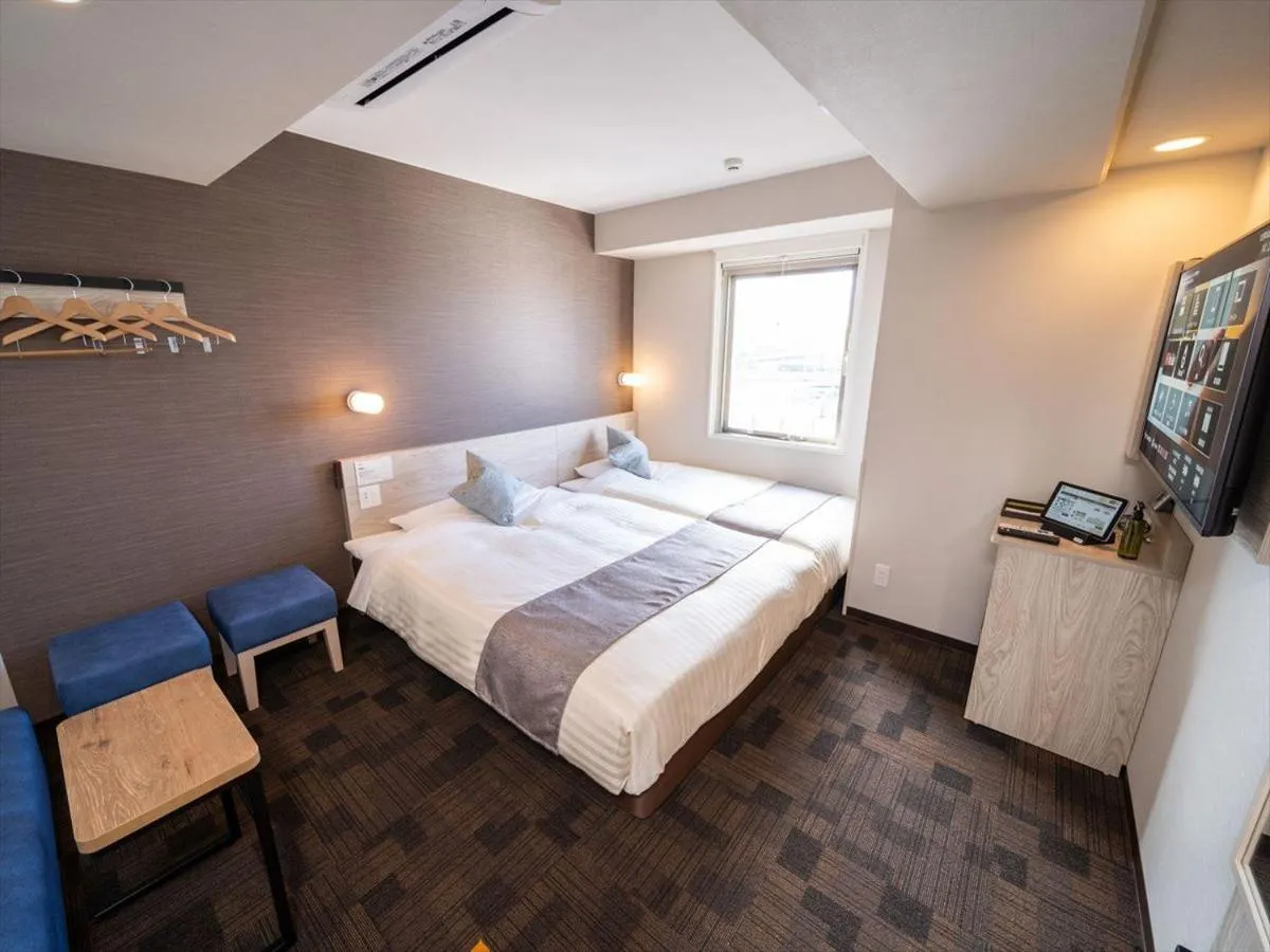 Bed in Super Hotel Premier Saitama Higashiguchi