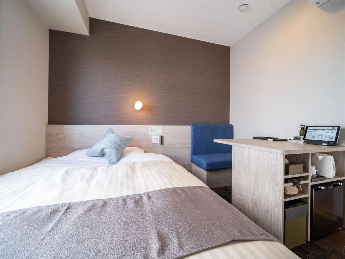 Bed in Super Hotel Premier Saitama Higashiguchi